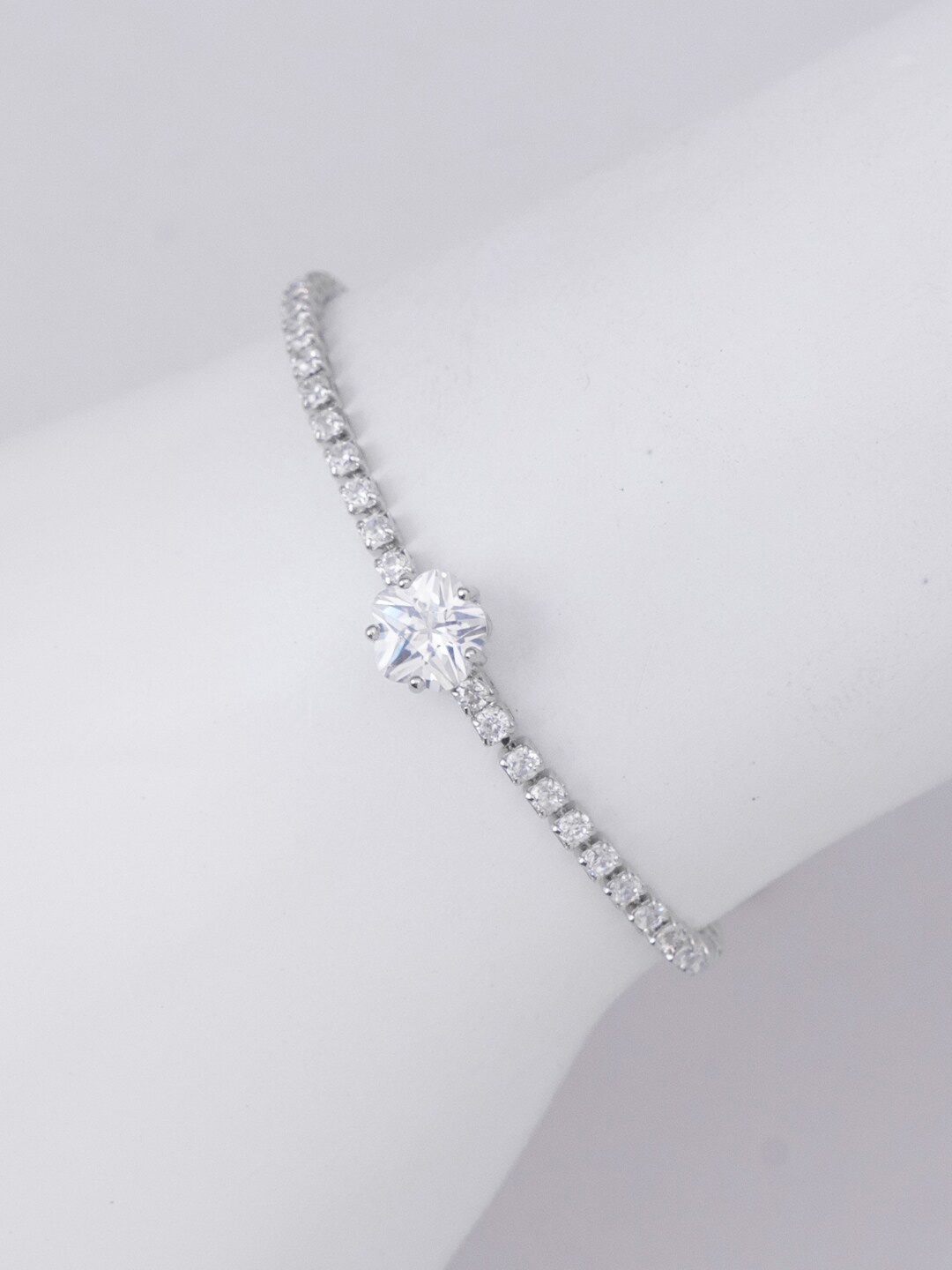 

SWASHAA Women Brass Cubic Zirconia Silver-Plated Wraparound Bracelet