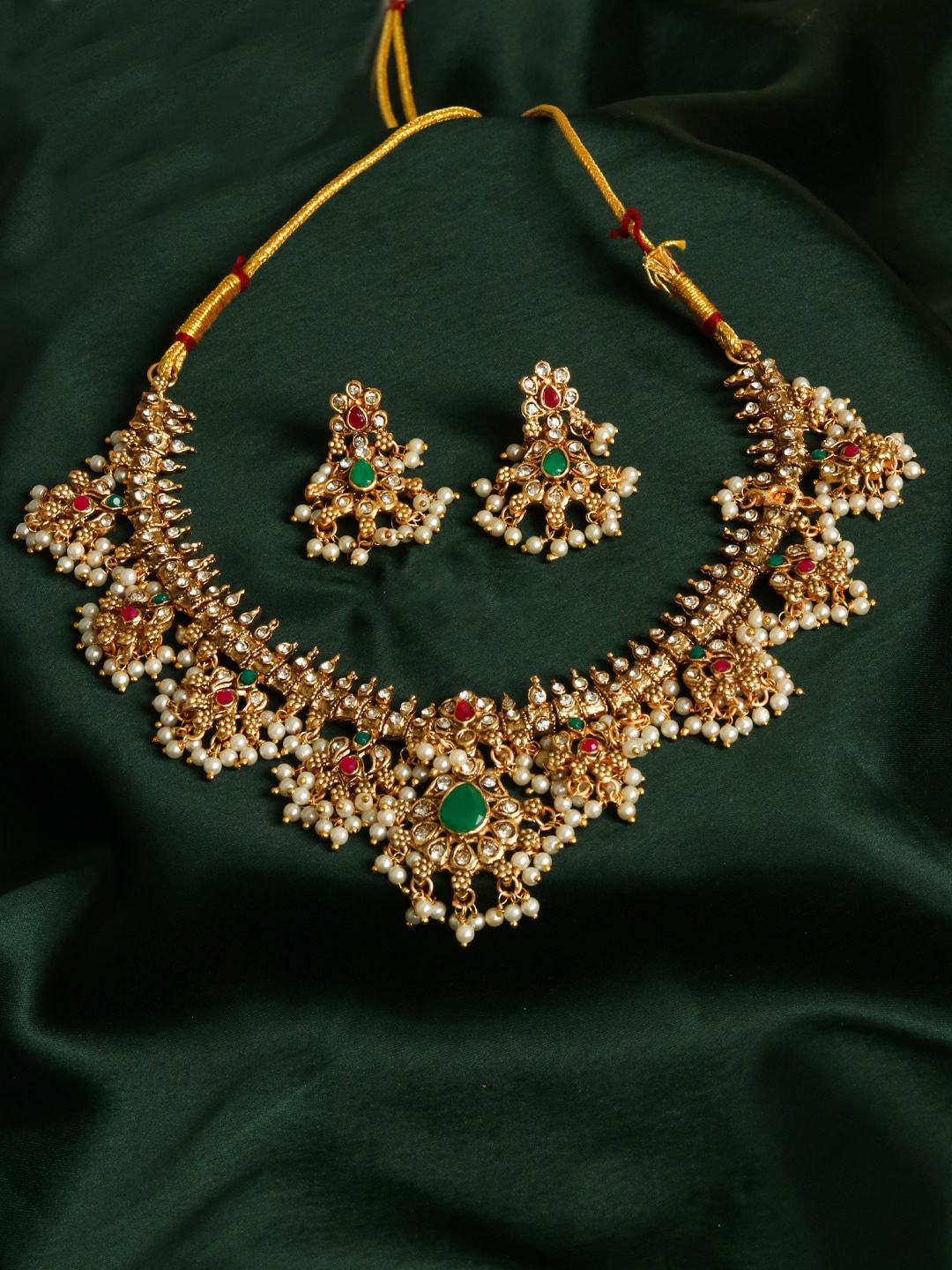 

Adwitiya Collection Gold Plated Stones Studded & Pearls Beaded Jewellery Set