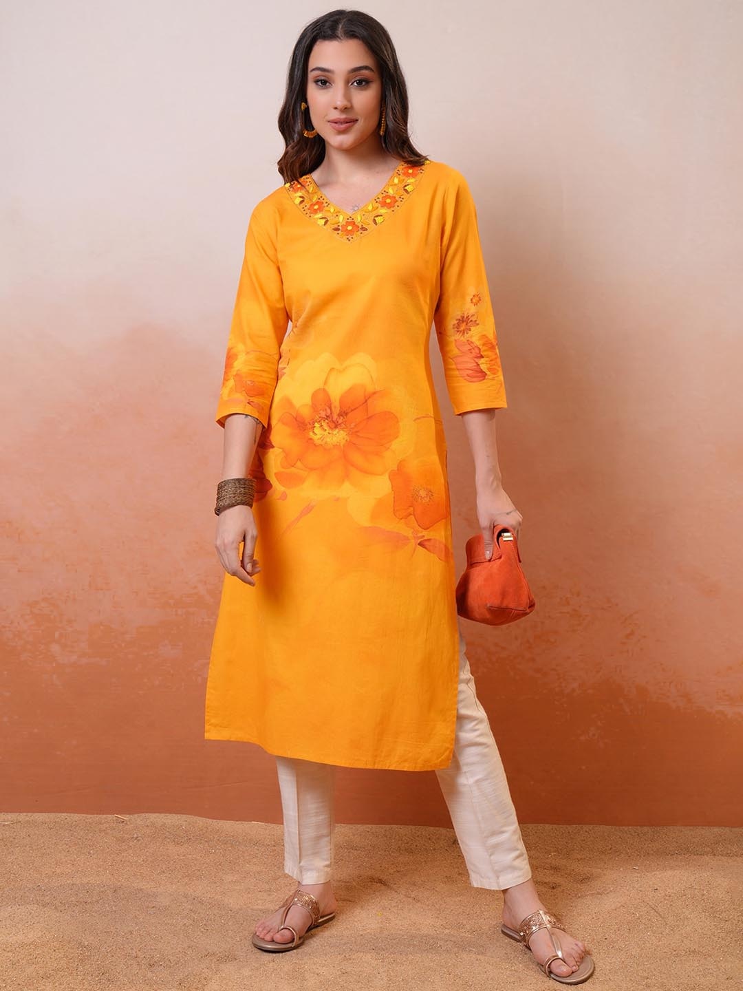 

Vishudh Mustard Yellow & Orange Floral Embroidered Thread Work V-Neck Kurta