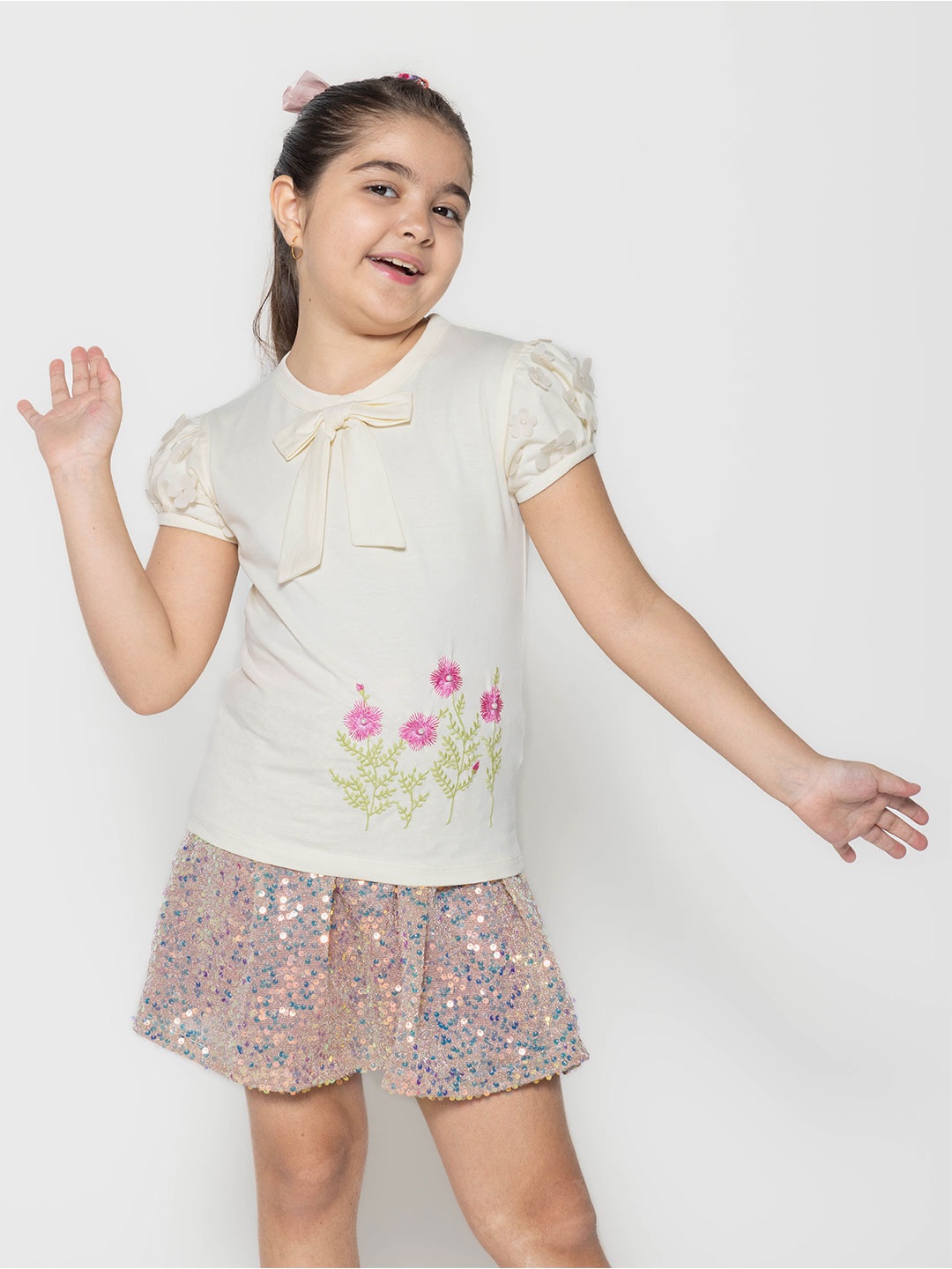 

PAMPOLINA Girls Floral Printed Tie-Up Neck Short Sleeves Cotton Top, Off white
