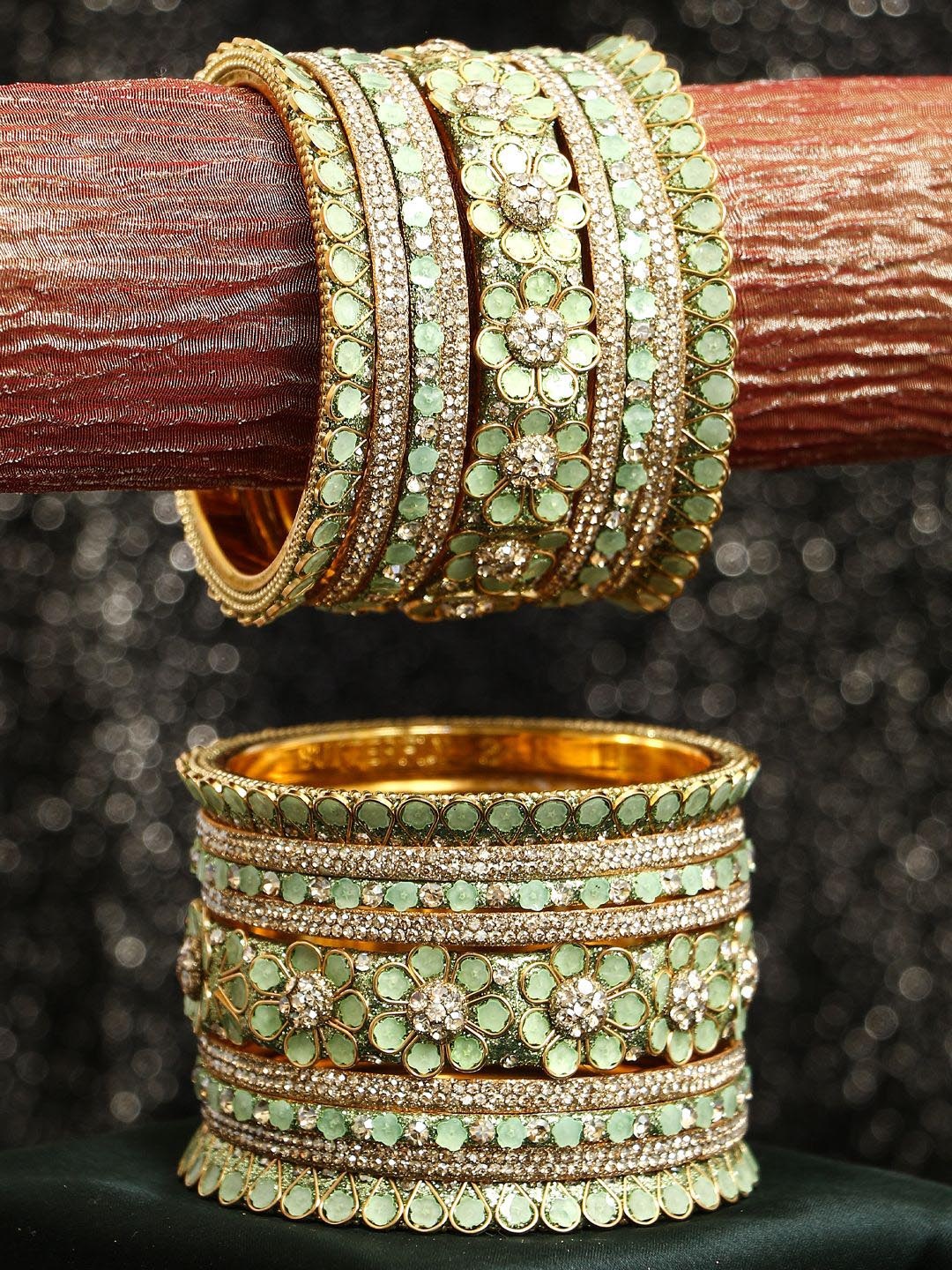 

Adwitiya Collection Set of 9 Gold-plated Stone-Studded Bangles