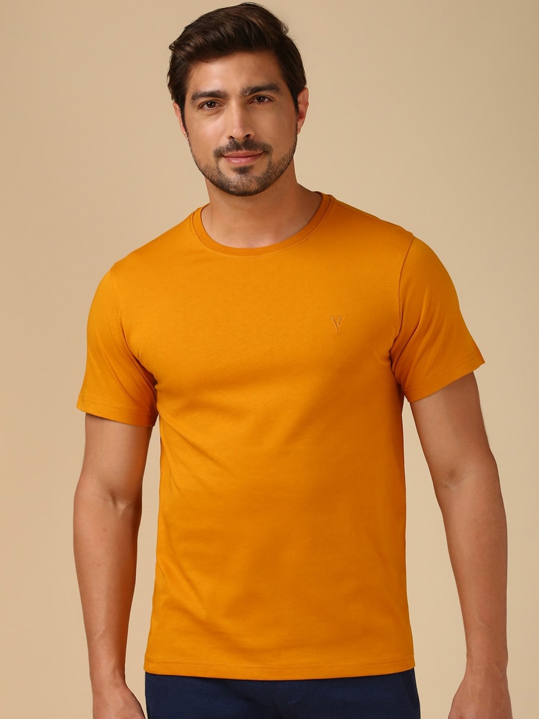 

Van Heusen Men Solid T-shirt, Orange