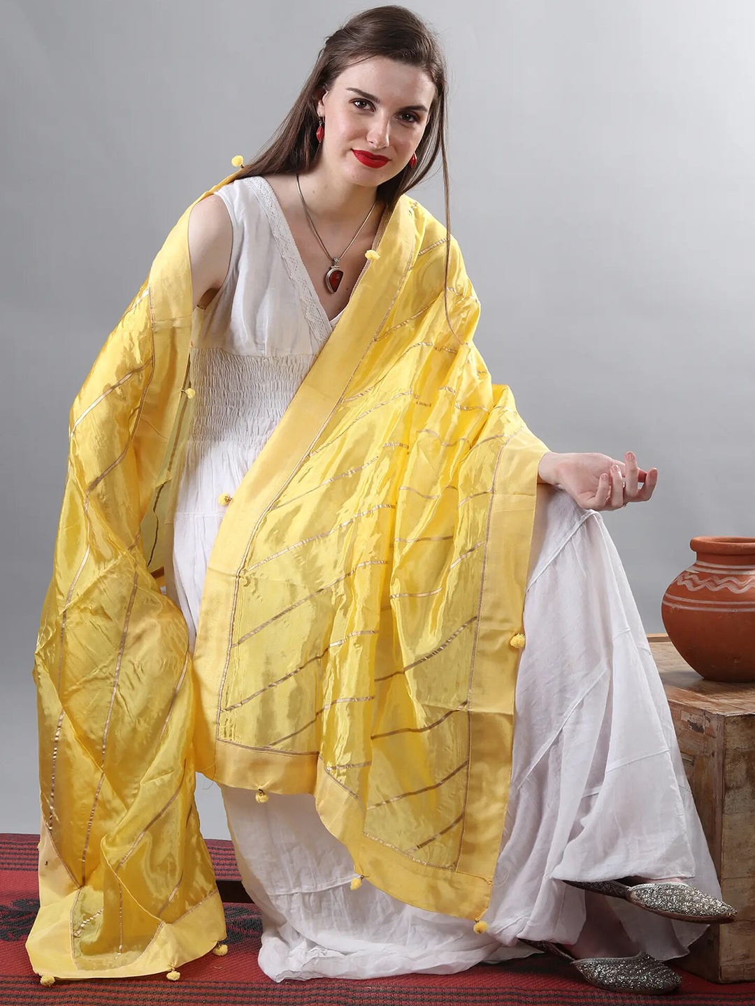 

Exotic India Pale Yellow Gota Silk Dupatta with Patch Border and Pom-Poms