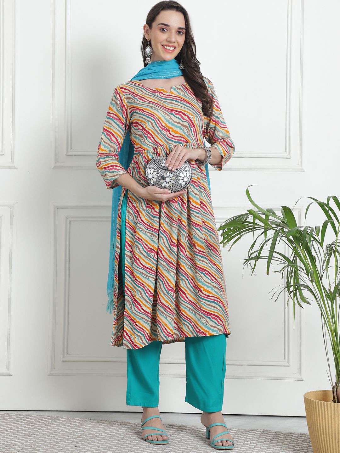 

KALINI Women Leheriya Printed Empire Kurta with Palazzos & With Dupatta, Beige