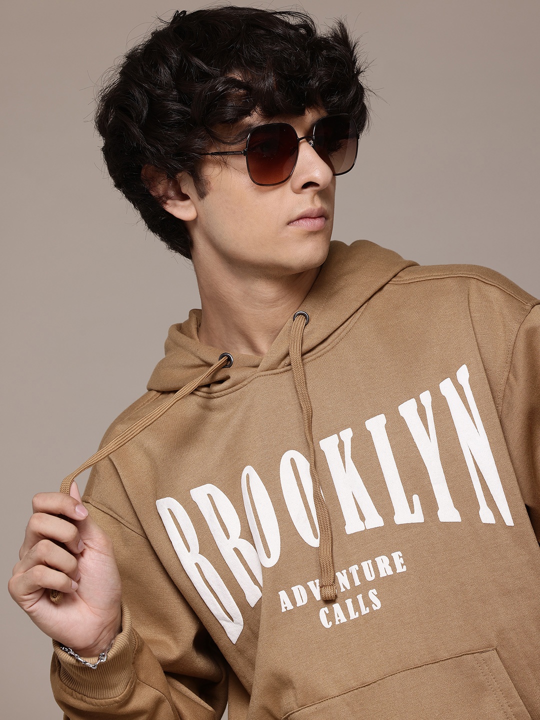 

The Roadster Lifestyle Co. Men Printed Hooded Relaxed Fit Sweatshirt, Brown