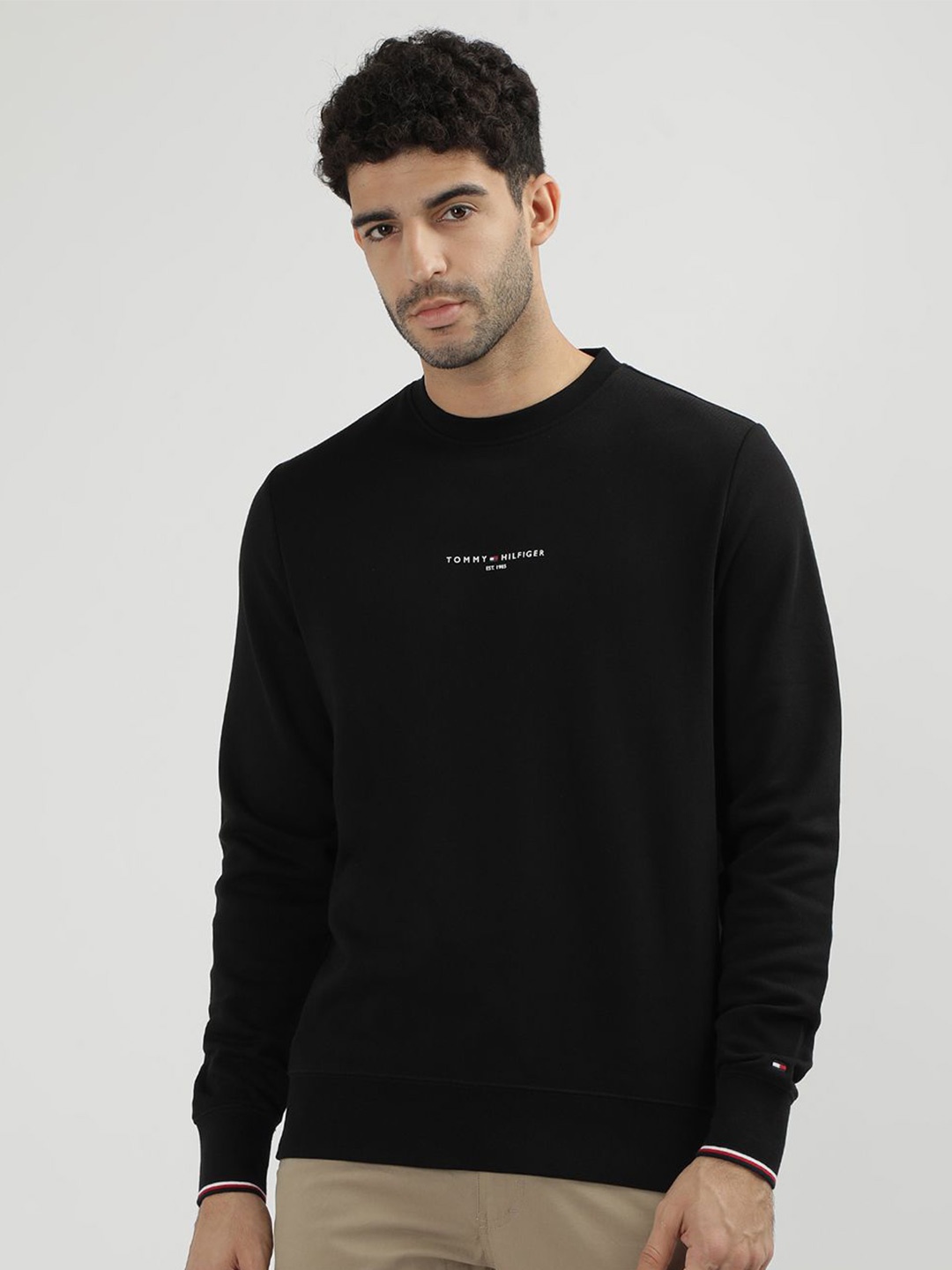 

Tommy Hilfiger Men Solid Round Neck Sweatshirt, Black