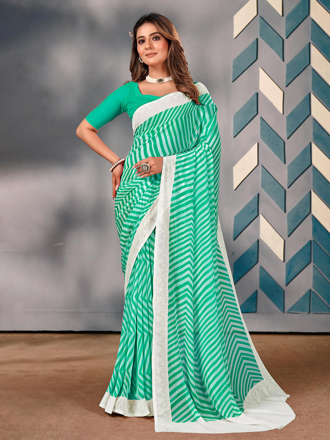 

Mitera Embroidered Pure Georgette Saree, Green