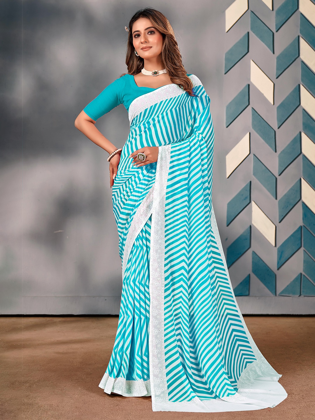 

Mitera Embroidered Pure Georgette Saree, Blue