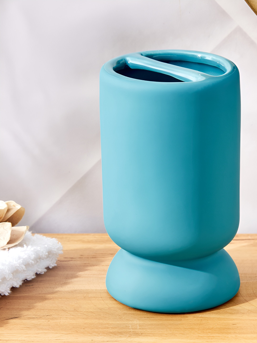 

Home Centre Blue Solid Ceramic Toothbrush Holder