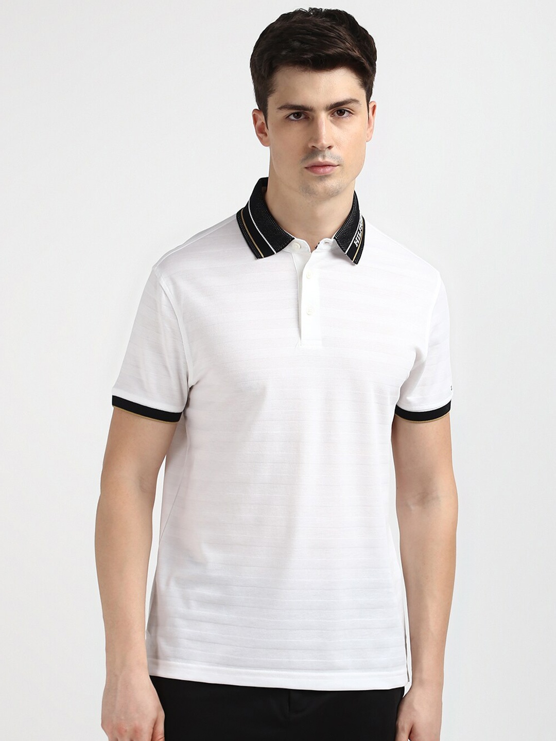 

Tommy Hilfiger Men Solid Polo Collar Pockets Slim Fit T-shirt, White