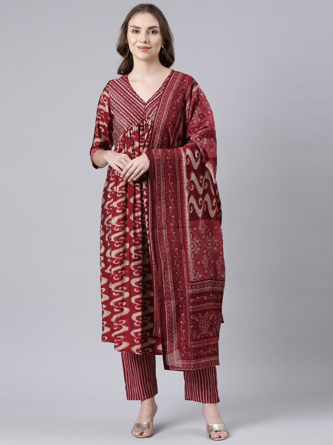 

Neerus Women Printed Panelled Mirror Work Kurta with Trousers & With Dupatta, Maroon