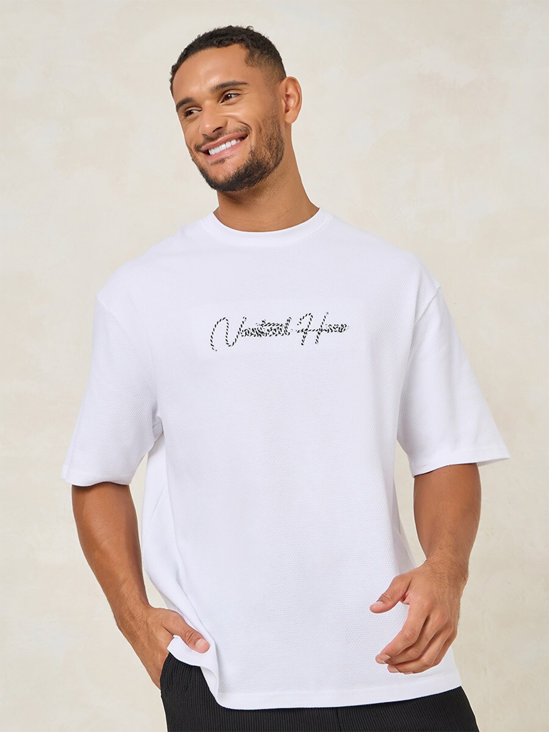 

Styli Men Premium Textured Knit Embroidered Oversized Tee, White