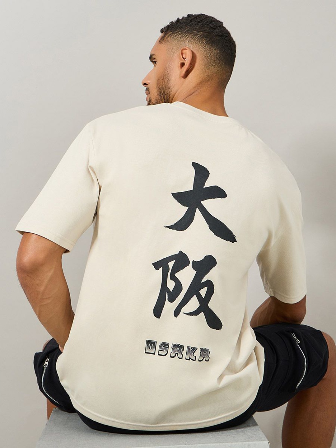 

Styli Men Text Graphic Back Printed Oversized Streetwear T-shirt, Beige