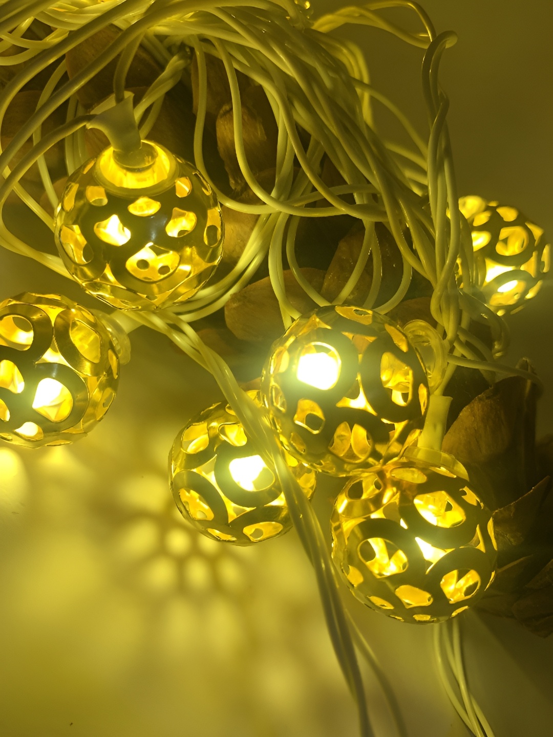 

SPARK WORLD Gold toned Cylindrical Shape String Lights