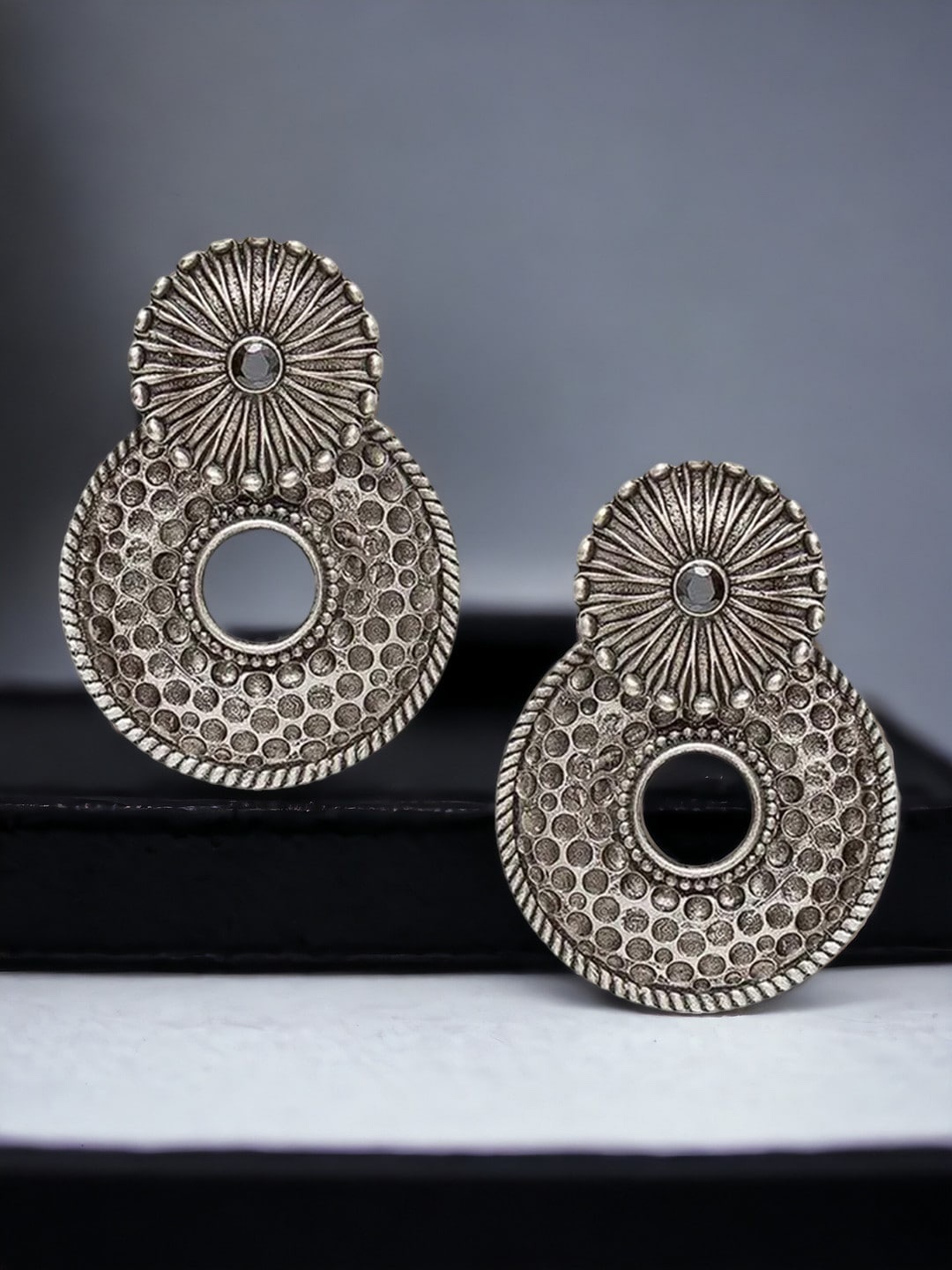 

Sangria Silver-Toned Stones Studded Circular Oxidised Drop Earrings