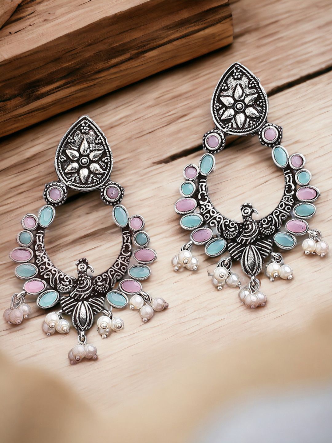 

Sangria Silver-Toned Stones Studded Peacock Shaped Oxidised Drop Earrings