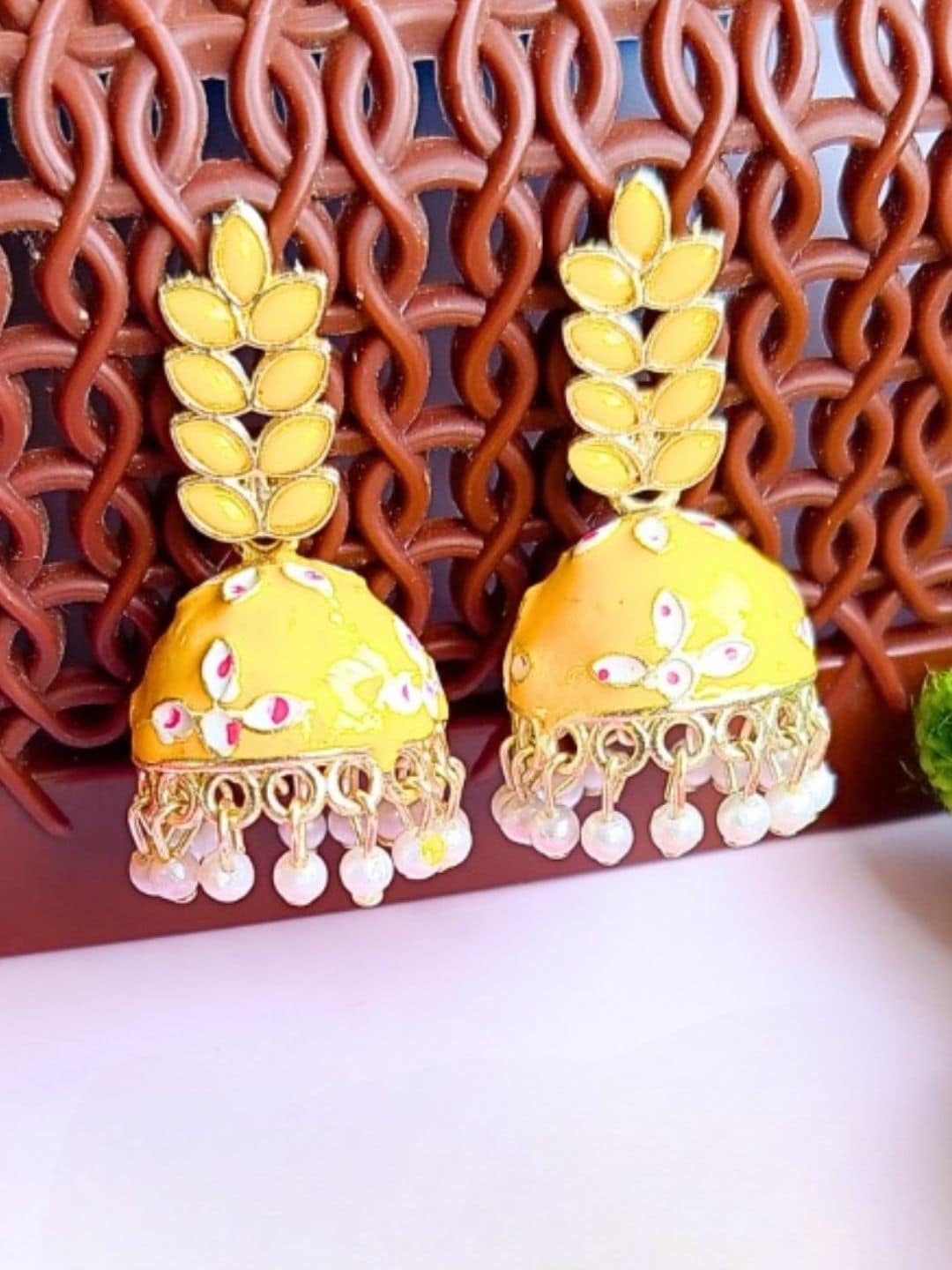 

Anouk Yellow Gold Plated Kundan Leaf Shaped Meenakari Jhumkas