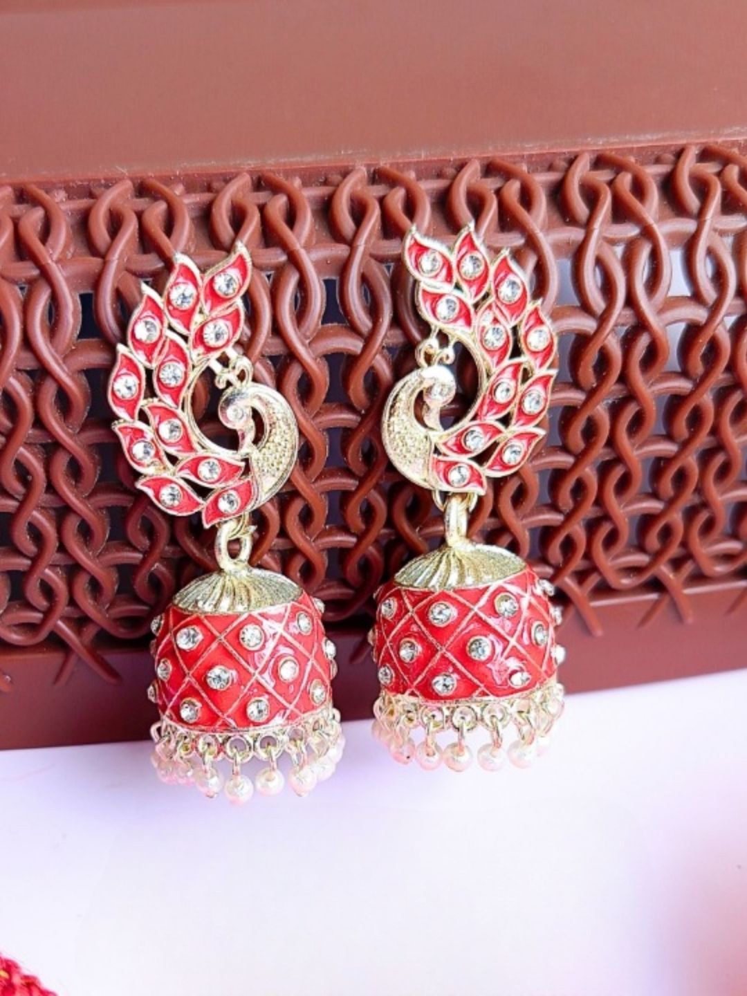

Anouk Red Gold Plated Beaded Peacock Shaped Jhumkas