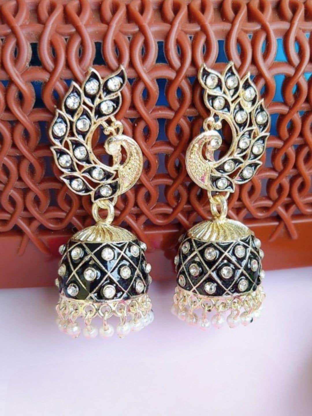 

Anouk Gold-Plated Peacock Shaped Jhumkas Earrings