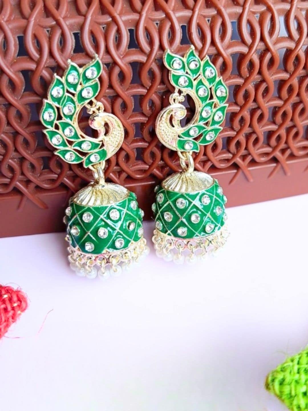 

Anouk Gold Toned & Green Gold Plated Peacock Shaped Meenakari Kundan Jhumkas