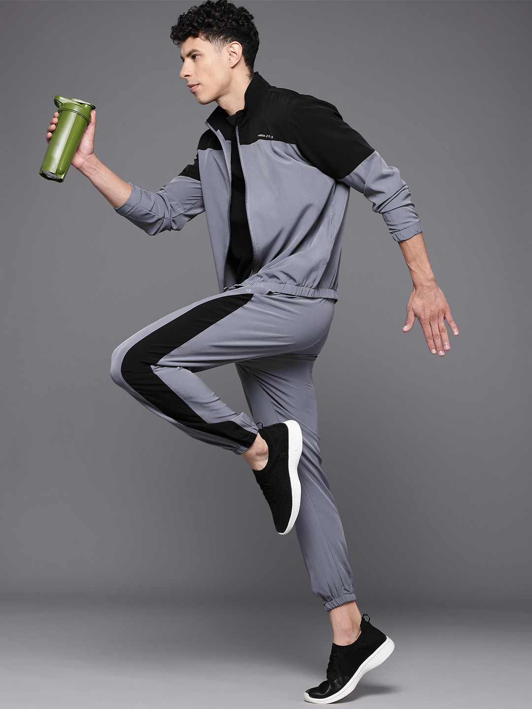 

HRX by Hrithik Roshan Men Black & Grey Colourblocked Running Tracksuits