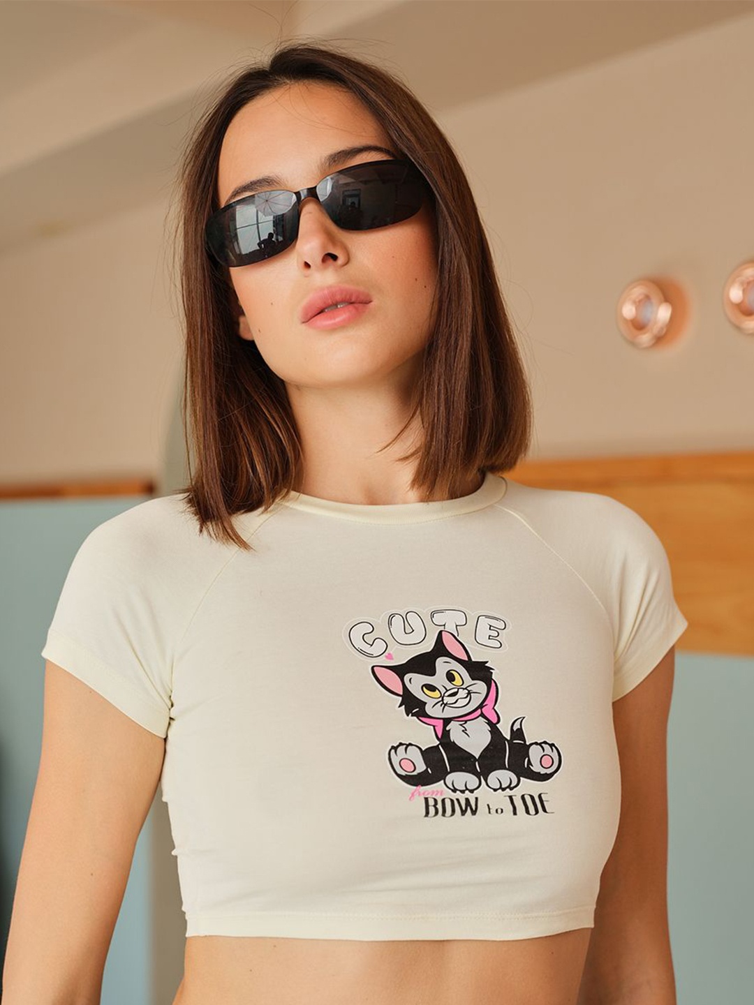 

Bonkers Corner Beige Typographic Printed Cap Sleeves Cotton Crop Top