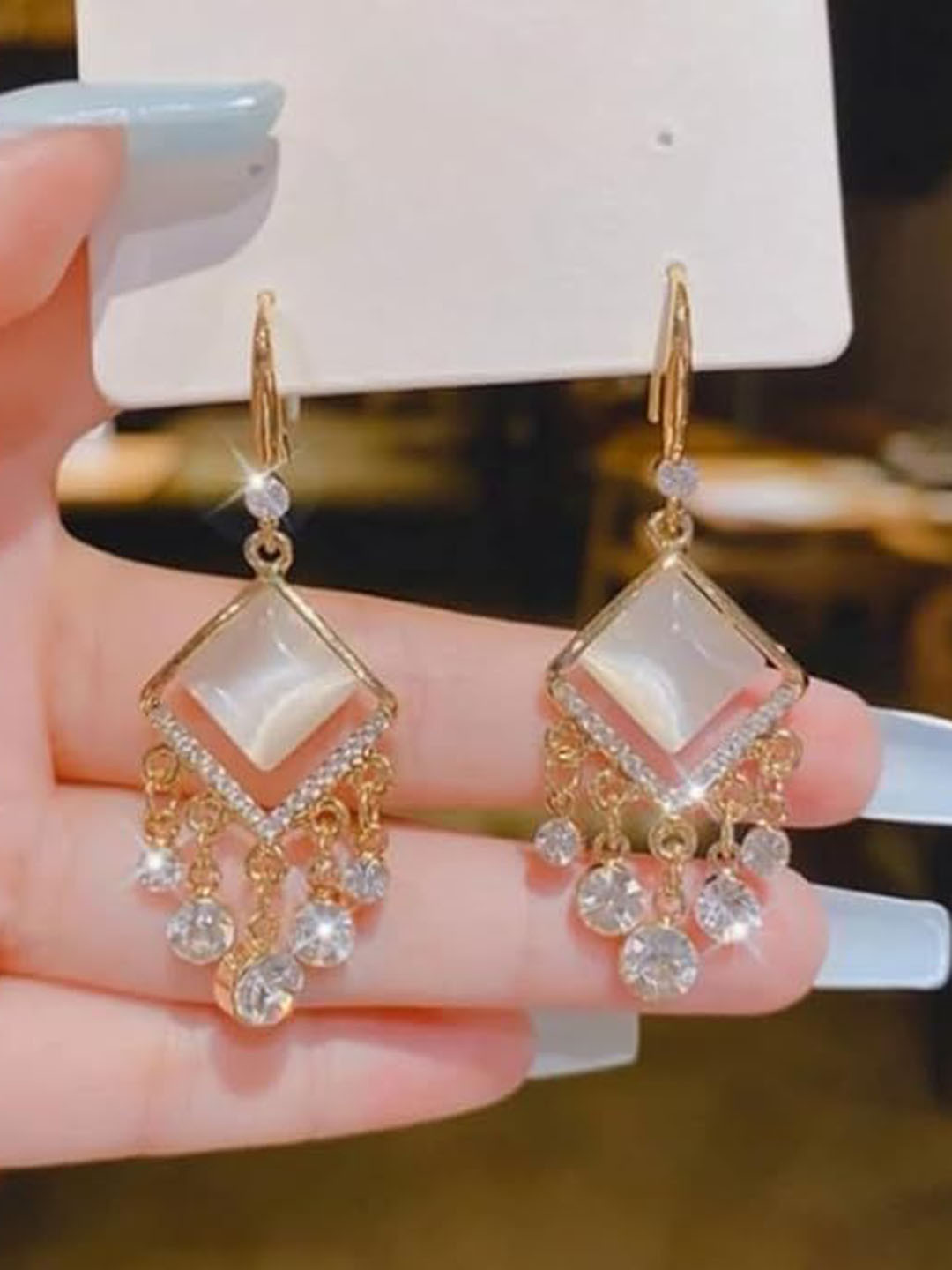 

Xivir Gold Plated Stones Studded Contemporary Drop Earrings