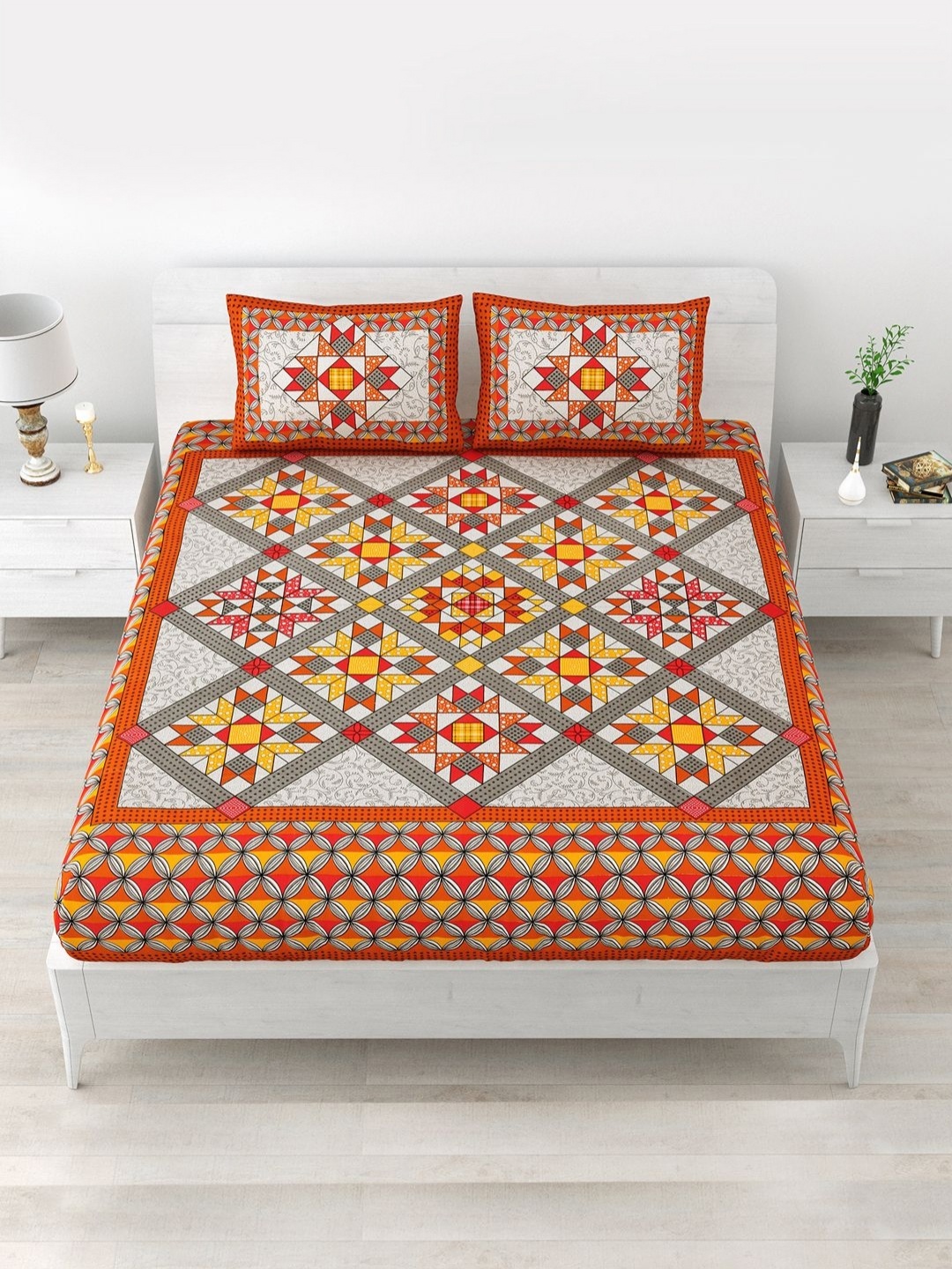 

Aapno Rajasthan Orange Geometric 120 TC Cotton Queen Bedsheet With 2 Pillow Covers
