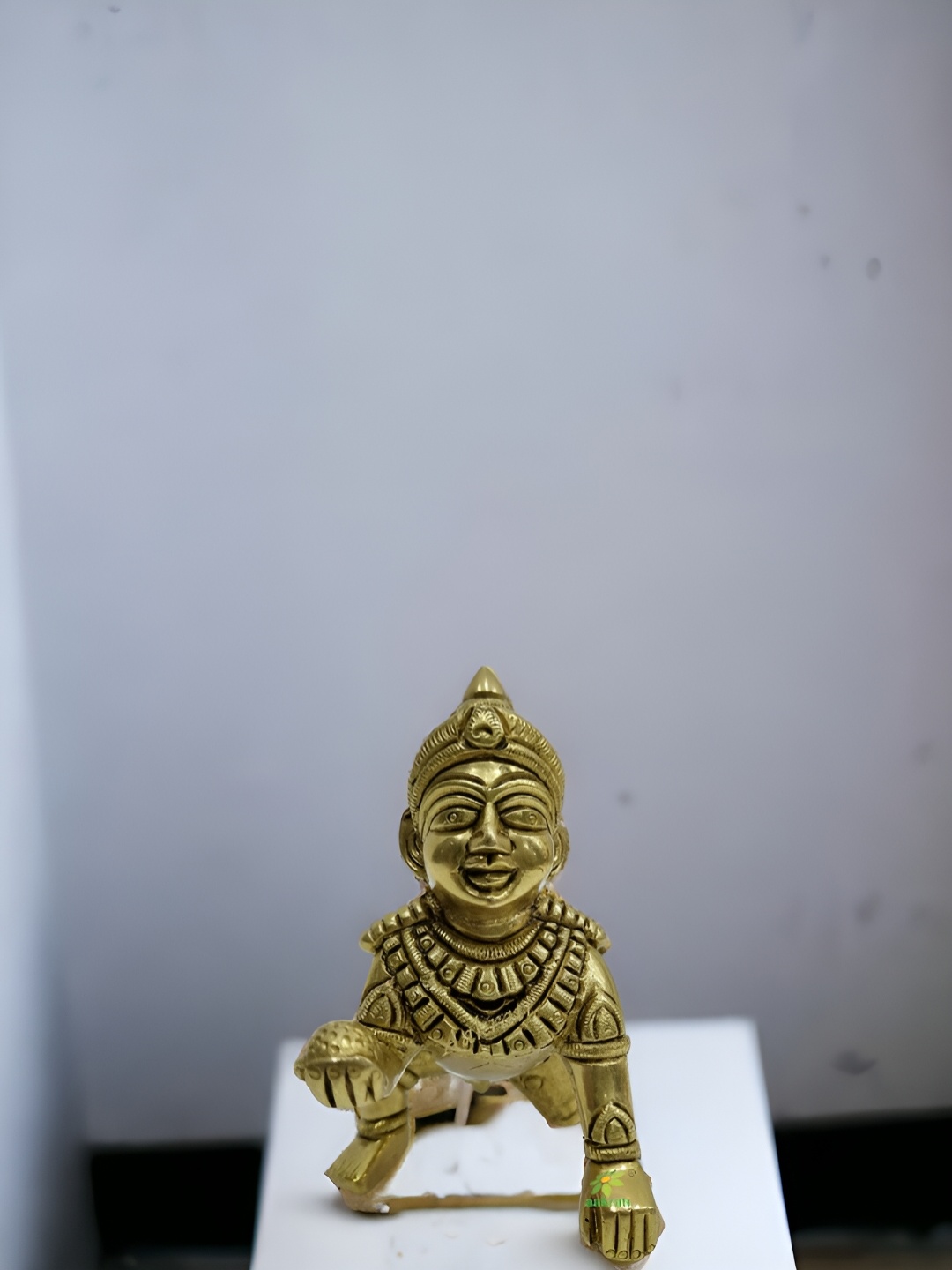 

Aakrati Yellow Religious Idol Showpiece