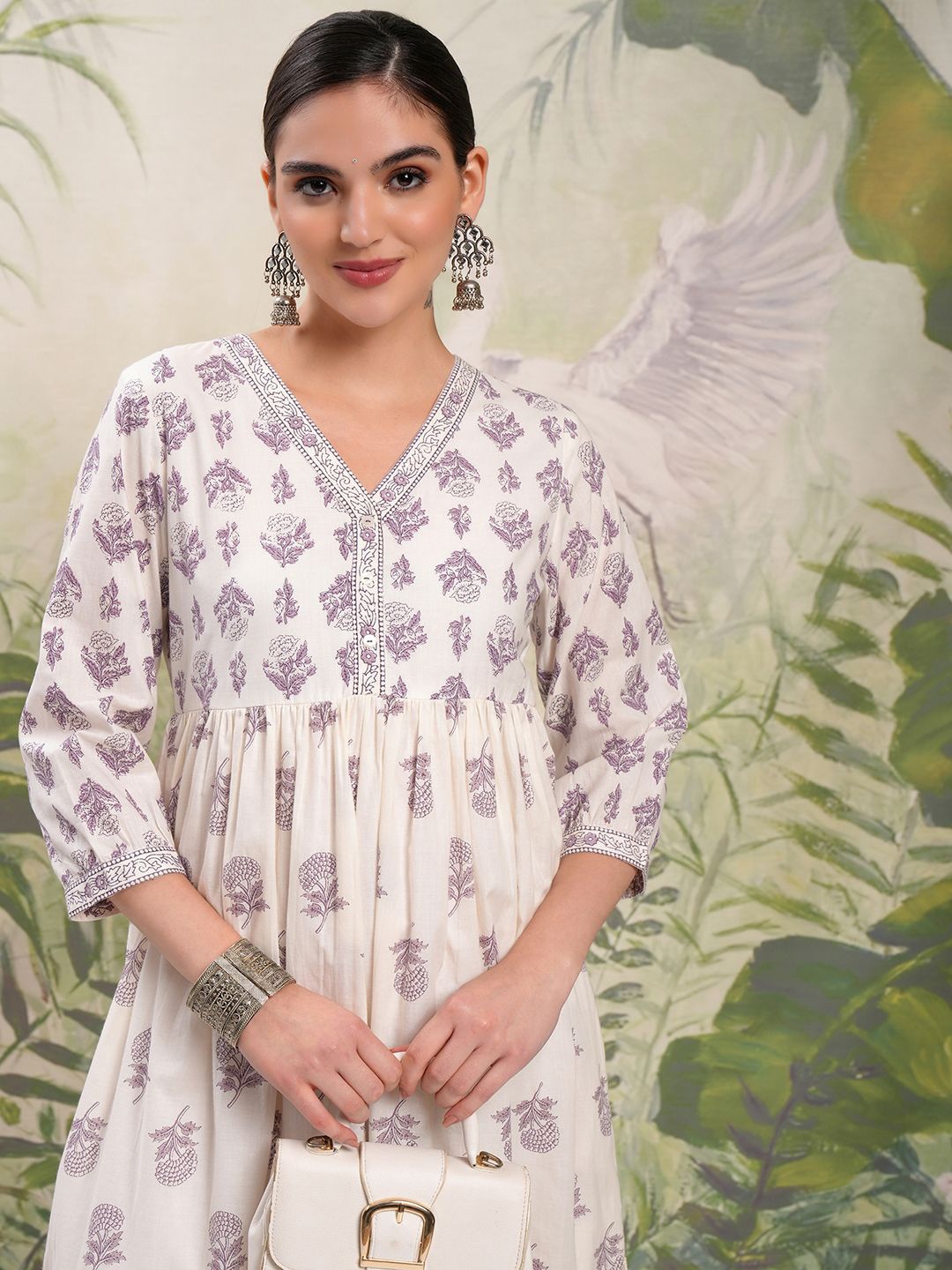 

Vishudh Cream & Lavender Floral Printed V-Neck Cotton Tiered Gathered A-Line Midi Dress