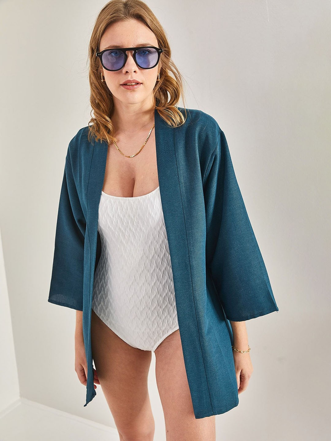 

BIANCO LUCCI Open Front Shrug, Blue