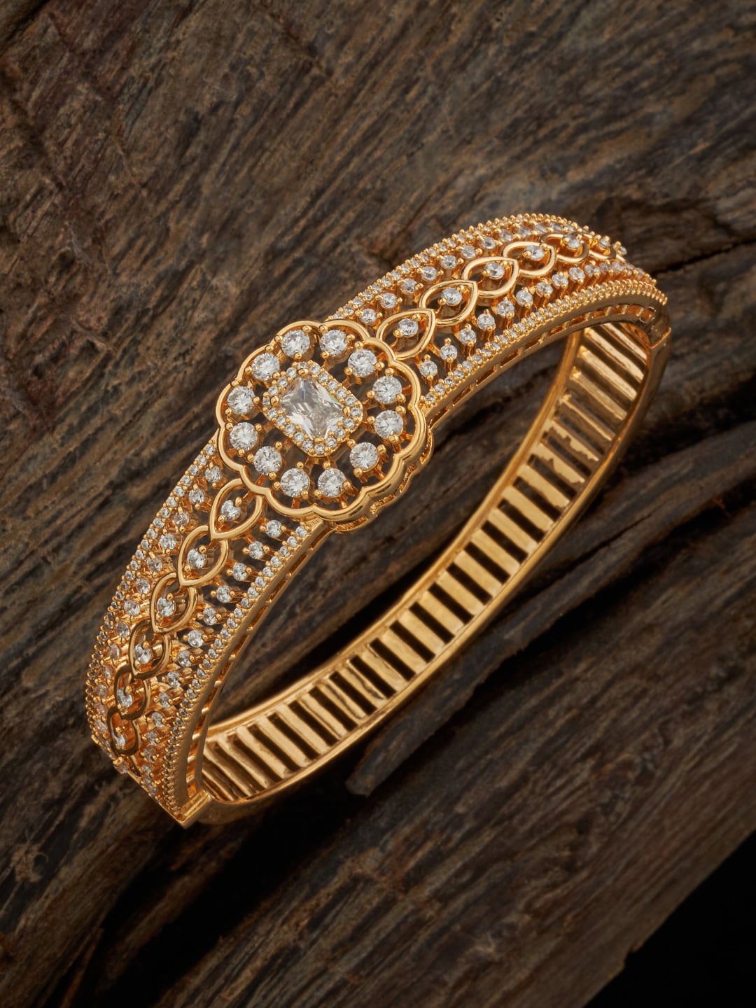 

Kushal's Fashion Jewellery Women Cubic Zirconia Gold-Plated Kada Bracelet