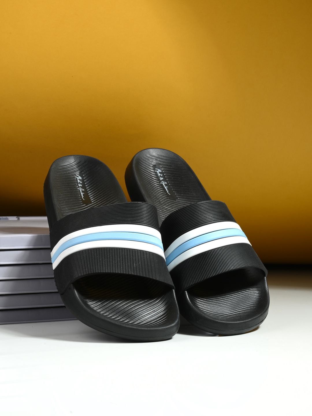 

Mast & Harbour Men Black Striped Rubber Sliders