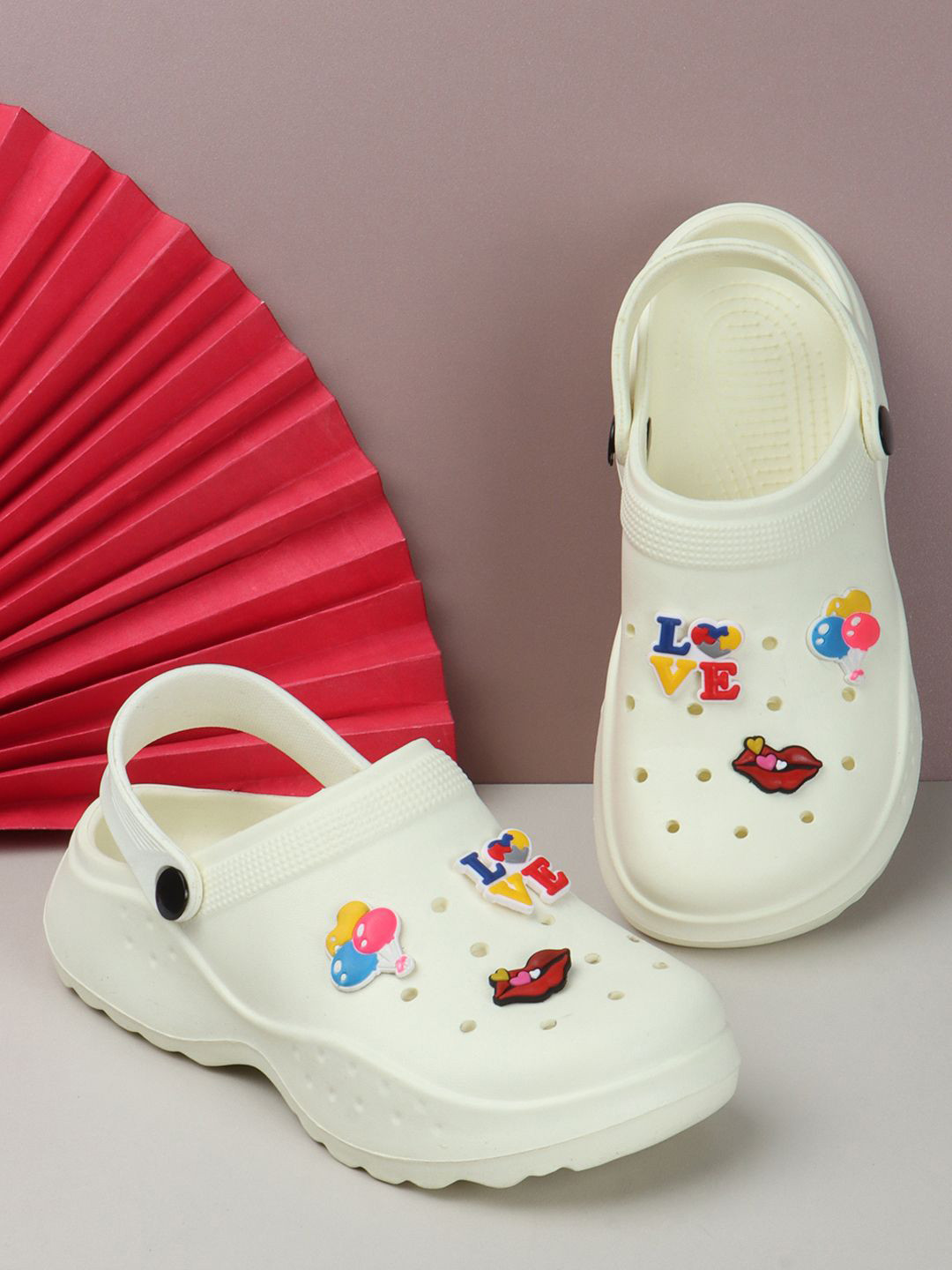

The Roadster Lifestyle Co. Women Cream-Coloured Self Design Lightweight Clogs