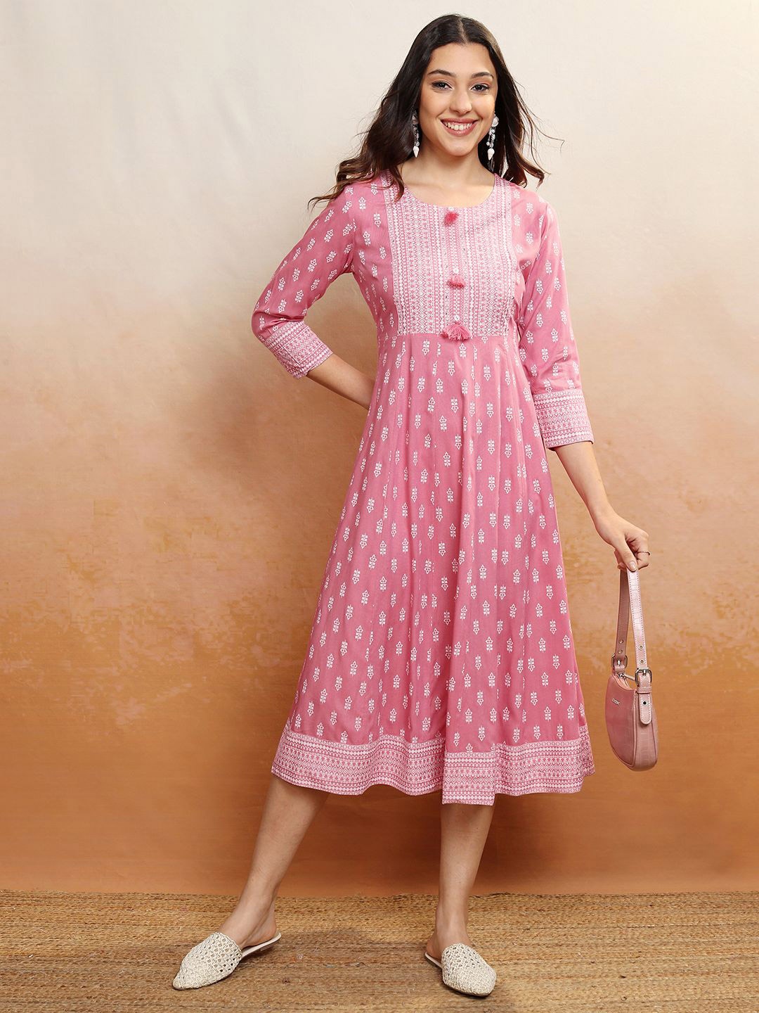 

Vishudh Women Ethnic Motifs Printed Embroidered Midi A-Line Dress, Peach