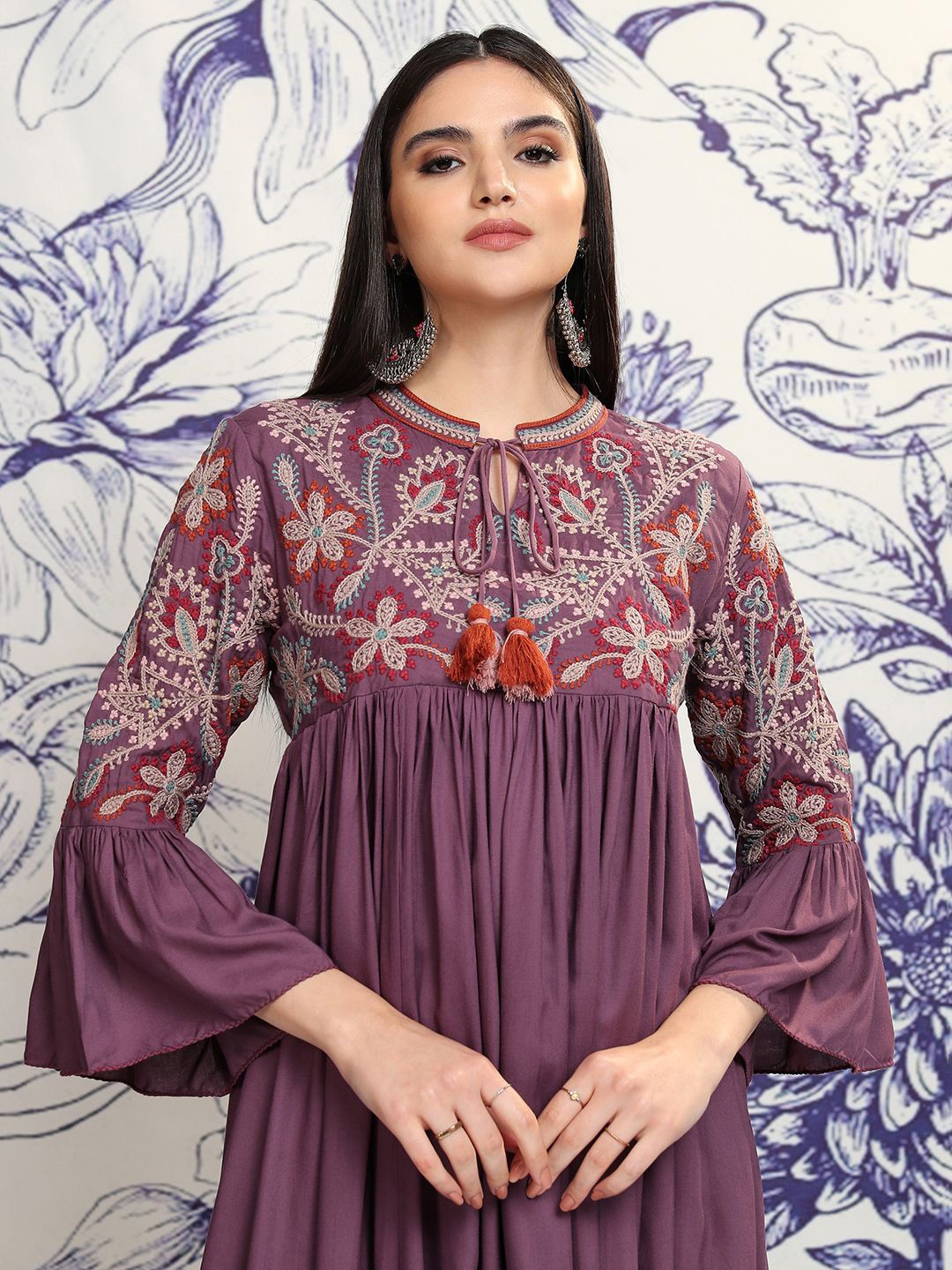 

Vishudh Women Embroidered Tie-Up Neck Flared Sleeves Gathered Empire Midi Ethnic Dress, Purple