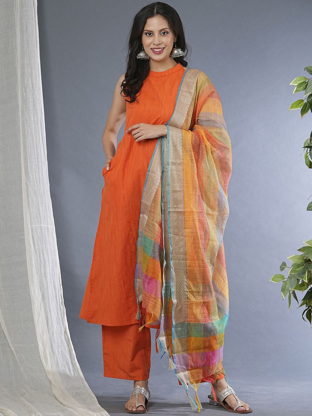 

Globus Orange Halter Neck A Line Kurta with Trousers & Dupatta