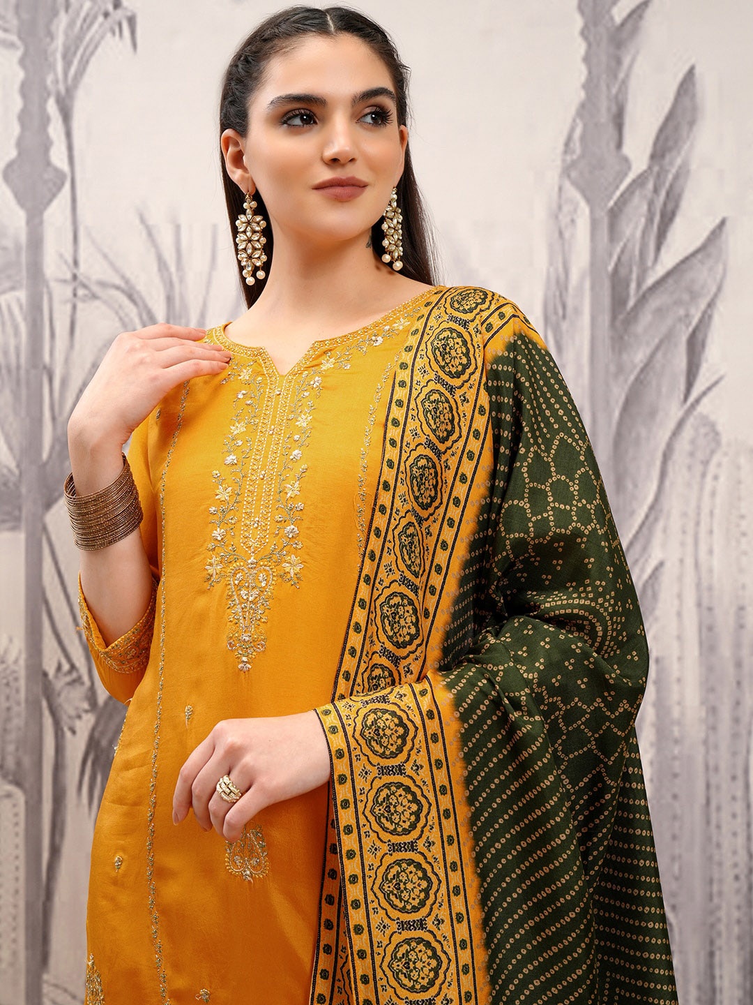 

Vishudh Mustard Ethnic Motifs Embroidered Regular Kurta with Trousers & Dupatta