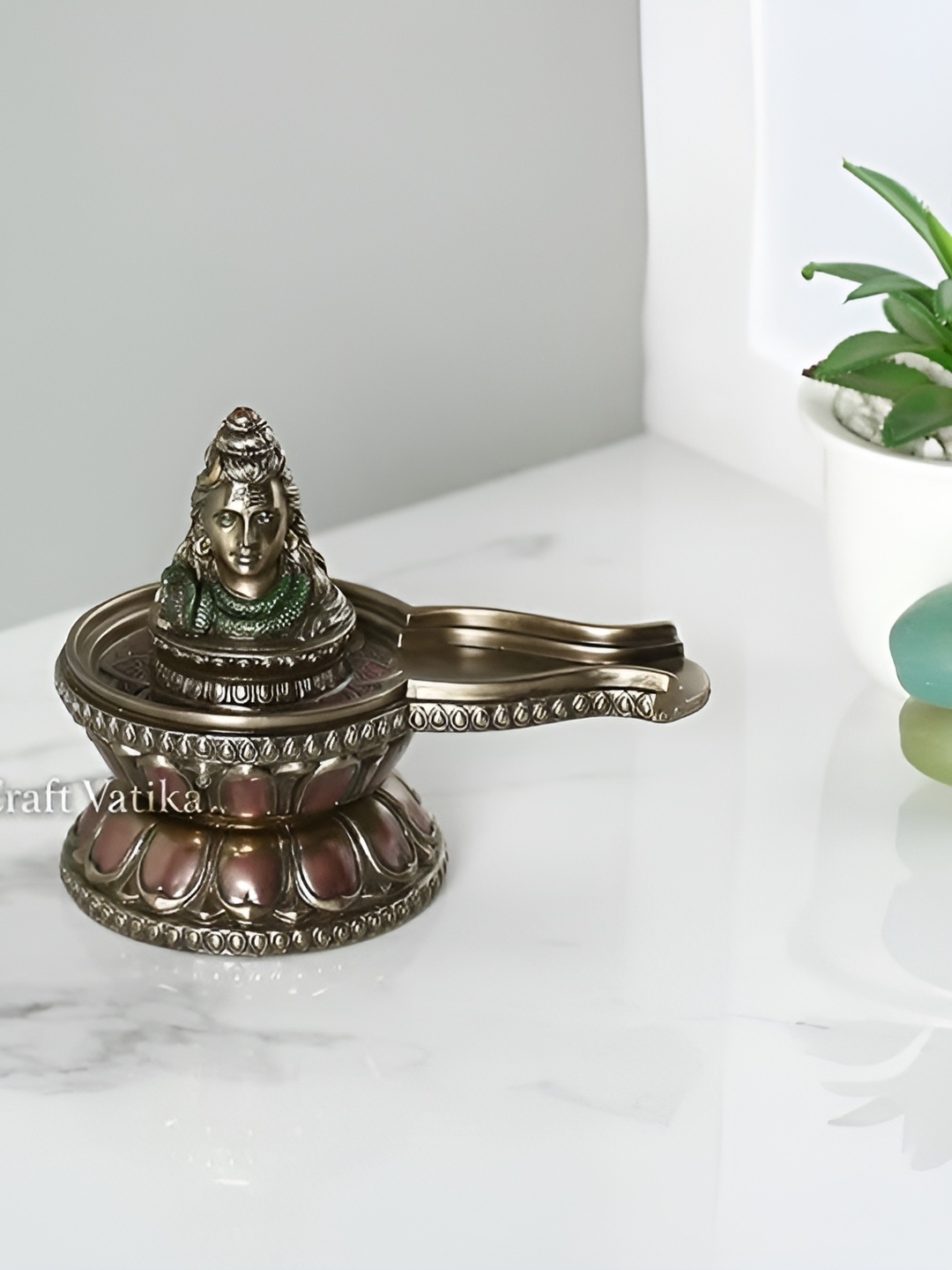 

Aura Gold Toned & Black Religious Idol Showpiece