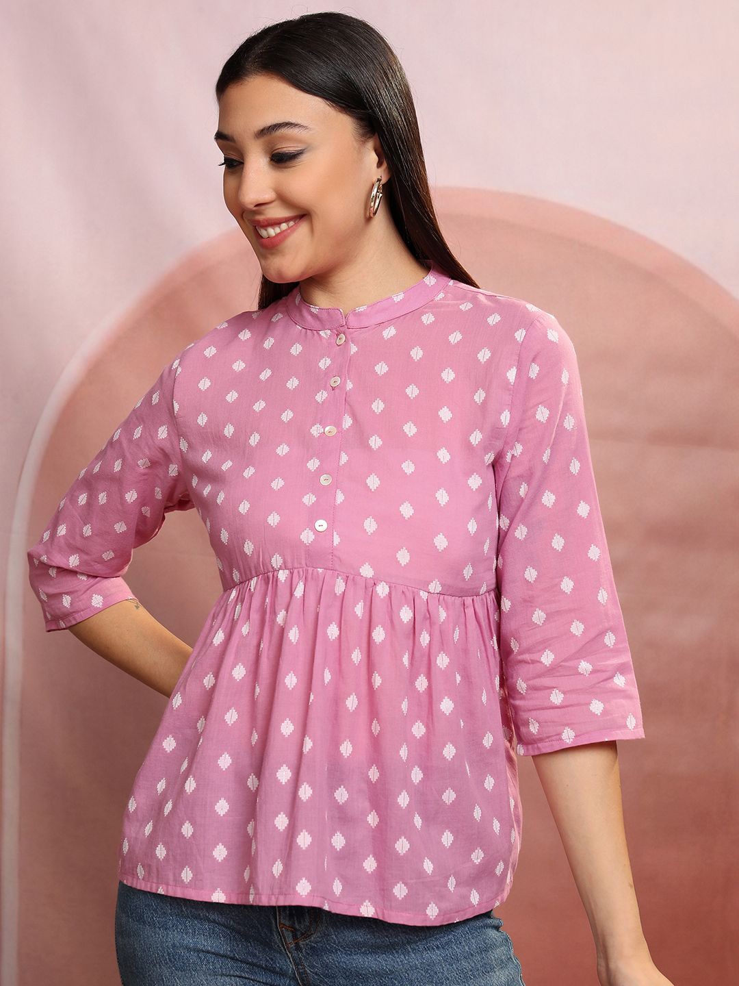 

Vishudh Pink Geometric Self Design Mandarin Collar Gathered or Pleated Cotton Peplum Top