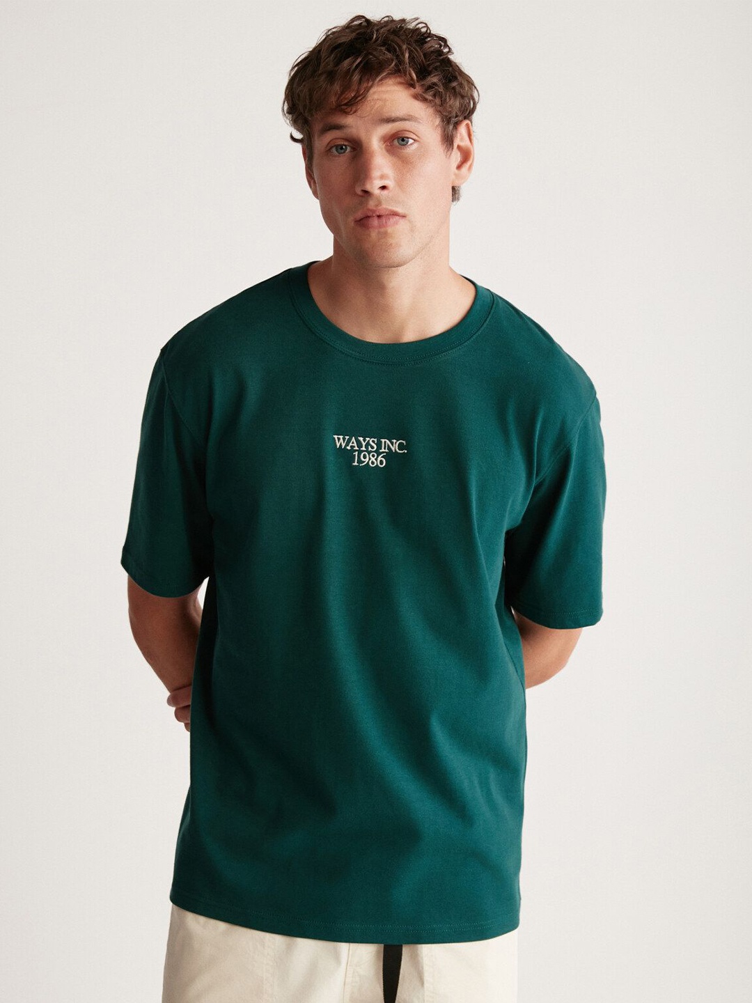 

GRIMELANGE Men Typography Printed Round Neck T-shirt, Green