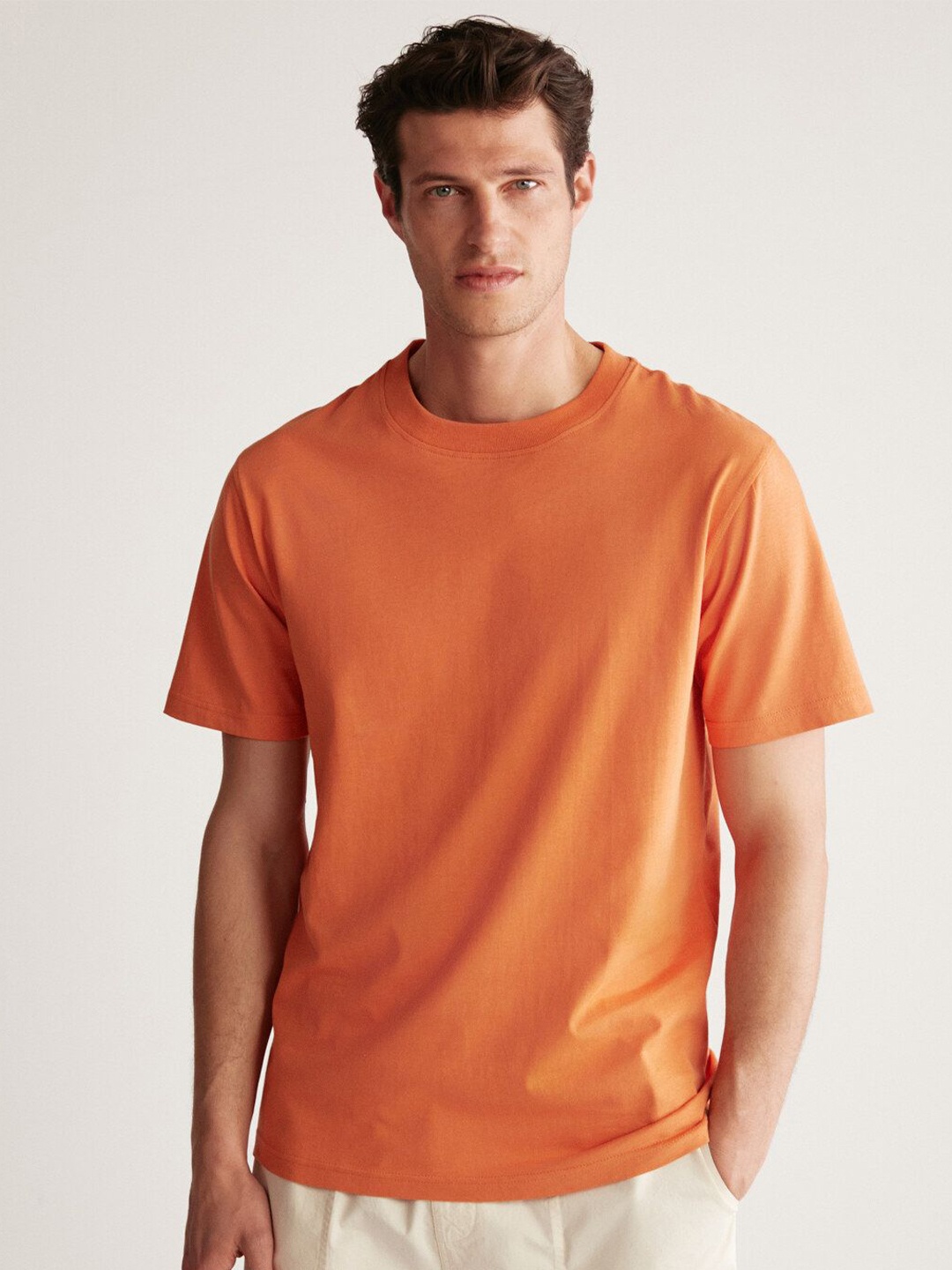 

GRIMELANGE Men Solid Round Neck T-shirt, Orange