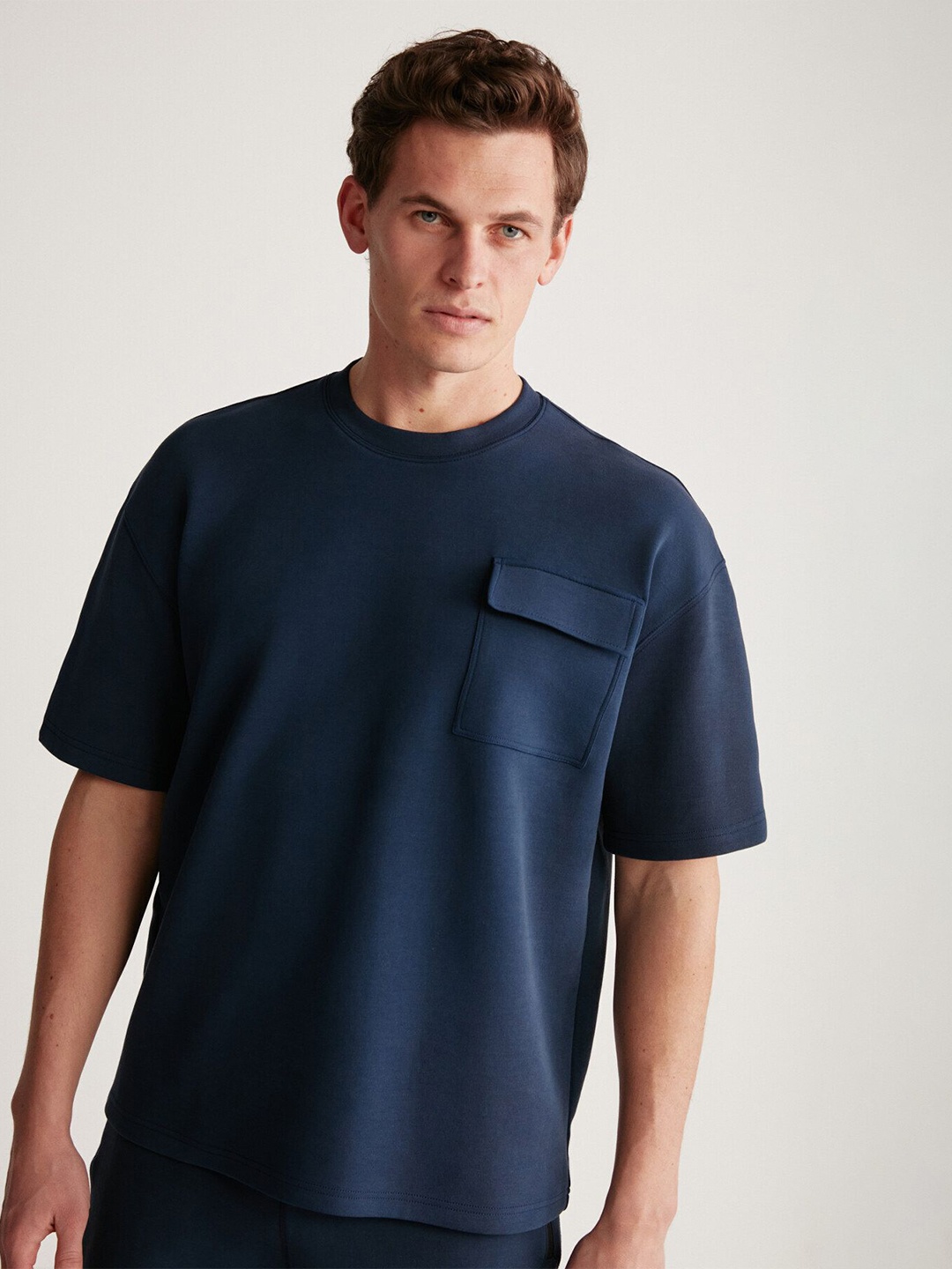 

GRIMELANGE Men Solid Round Neck Pocket T-shirt, Navy blue