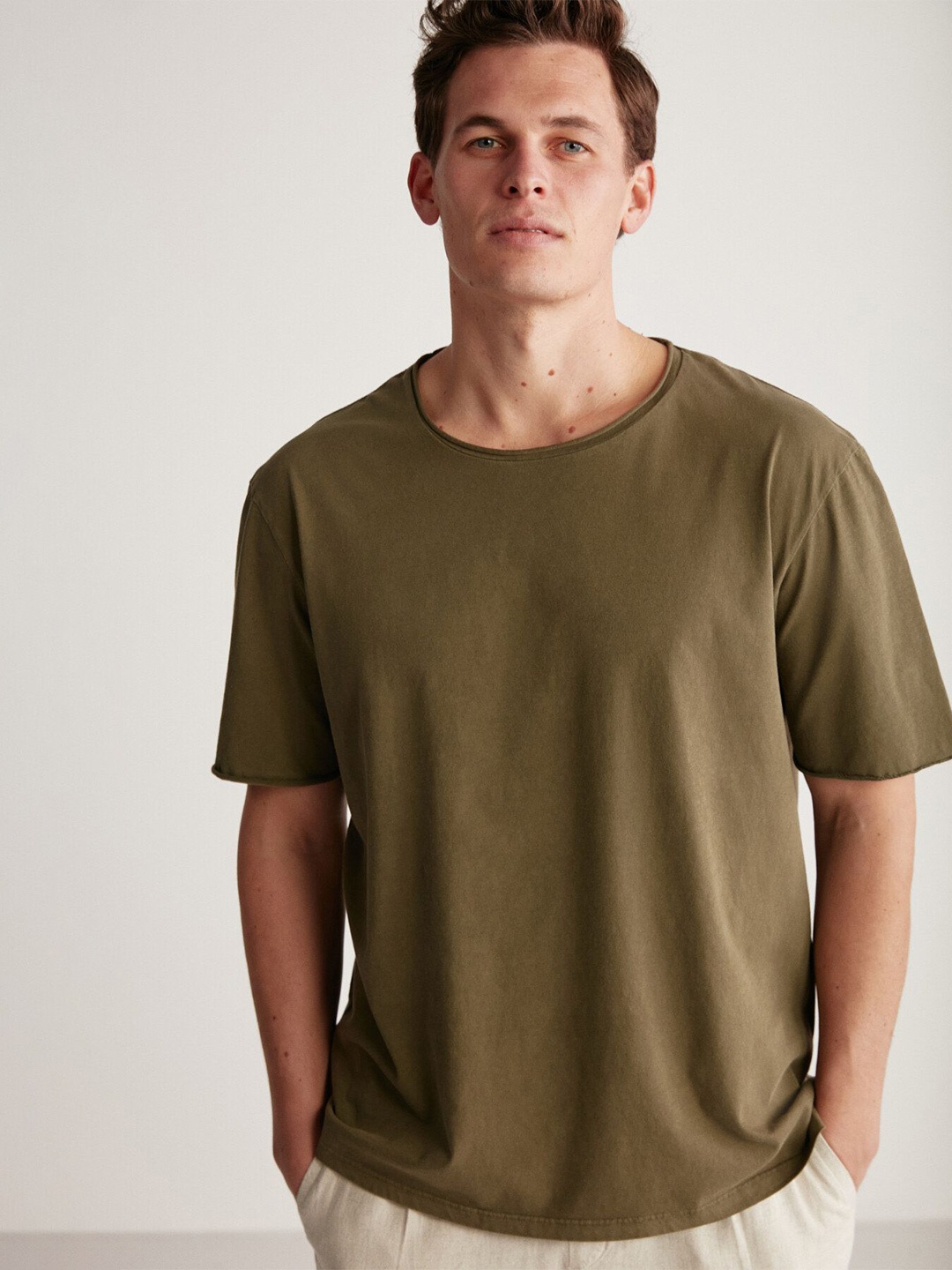 

GRIMELANGE Men Solid Round Neck T-shirt, Khaki