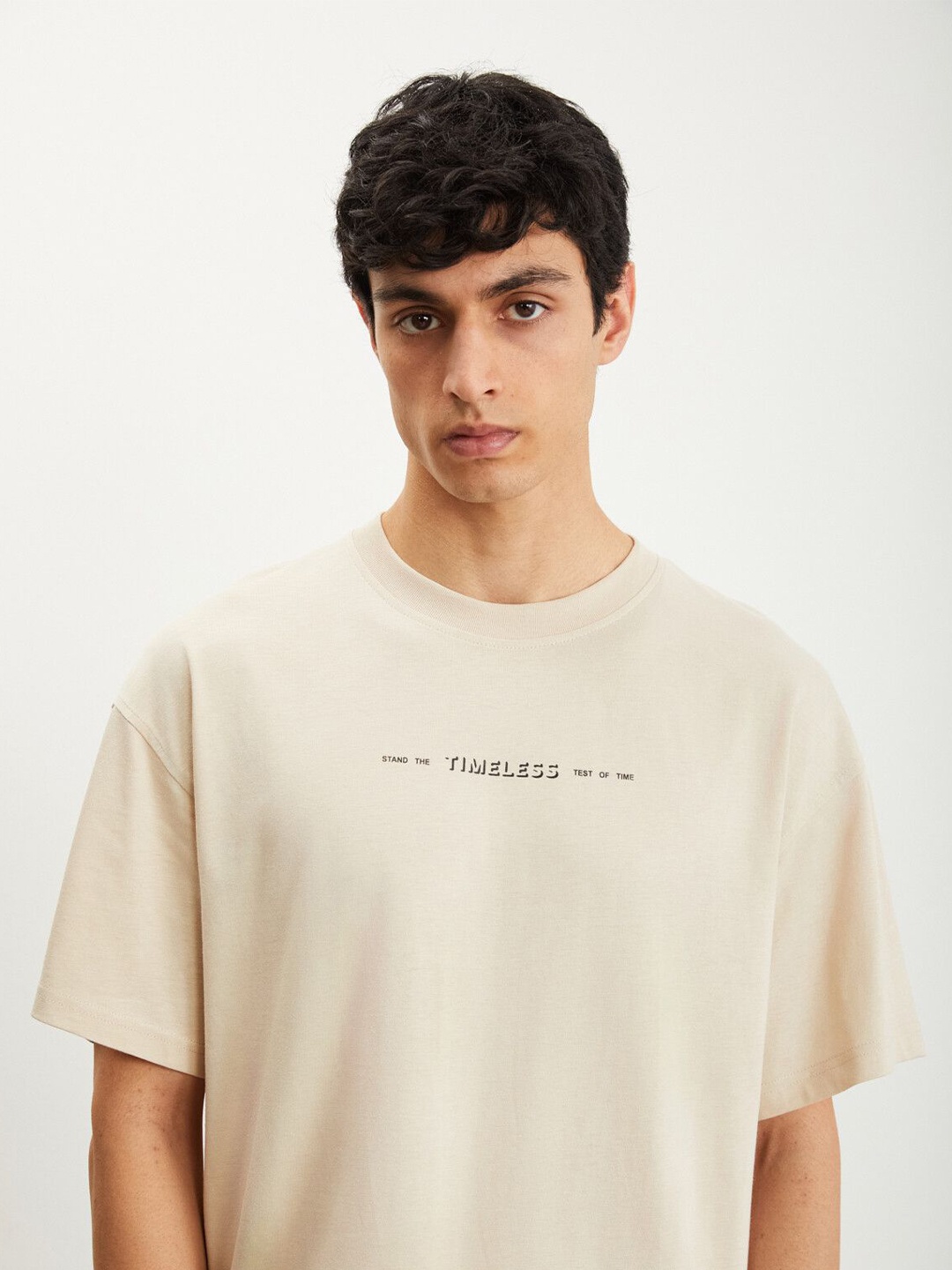 

GRIMELANGE Men Typography Printed Round Neck T-shirt, Beige