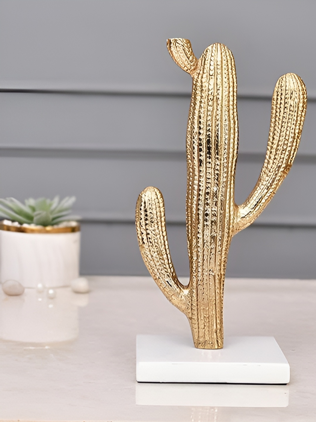 

Aura Gold-Toned & White Metal Figurine Showpiece