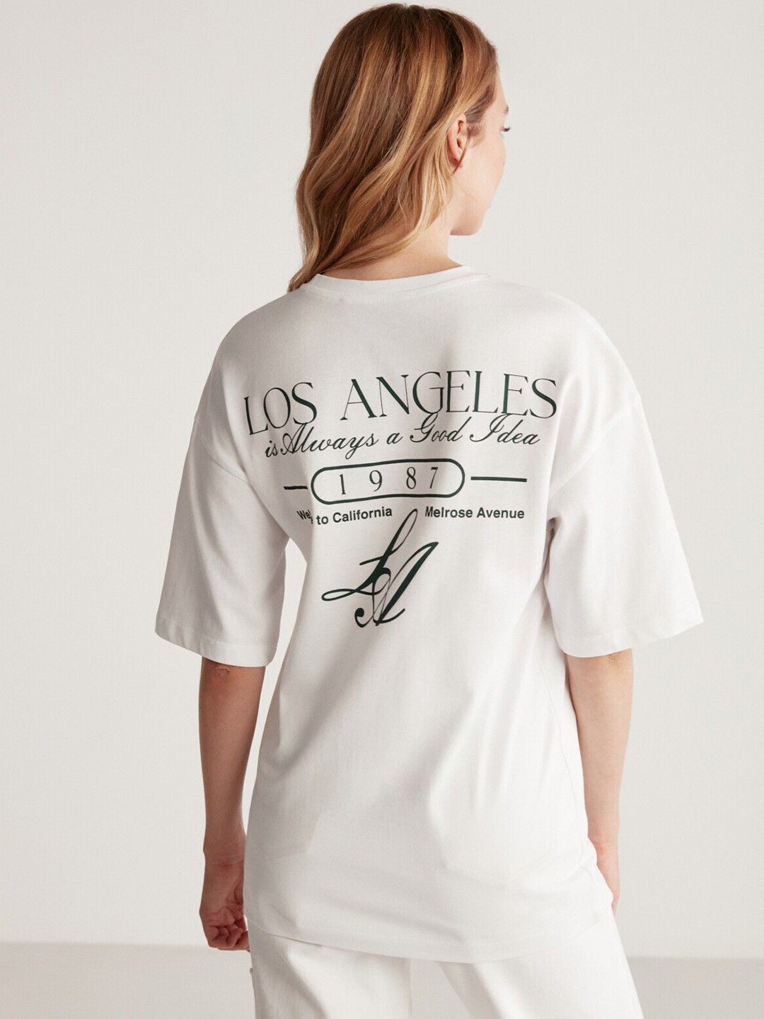 

GRIMELANGE Women Typography Round Neck Oversized T-shirt, White