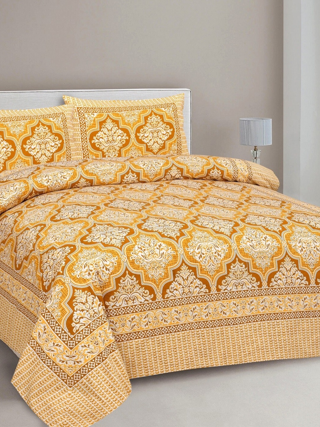 

Aura Yellow & White Ethnic Motifs 144 TC King Bedsheet with 2 Pillow Covers