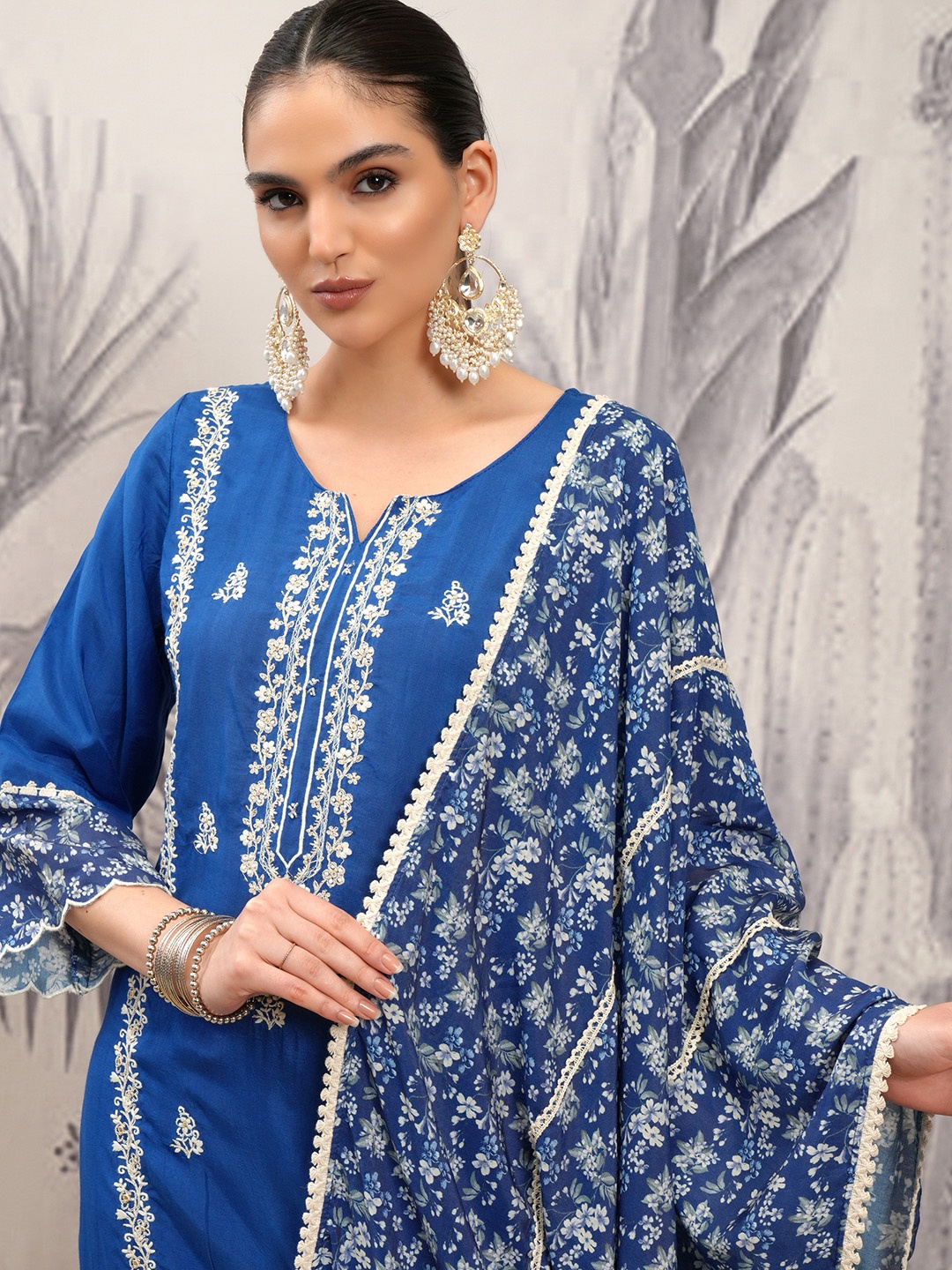 

Vishudh Blue Floral Embroidered Notch Neck Straight Kurta With Trousers & Dupatta
