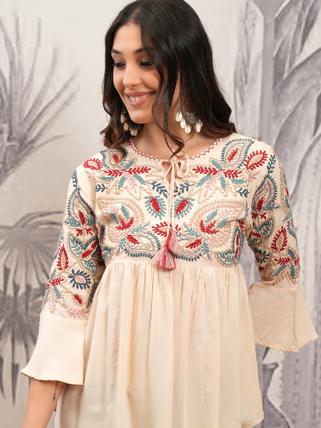 

Vishudh Beige Floral Embroidered Tie-Up Neck Bell Sleeves Gathered or Pleated A-Line Top